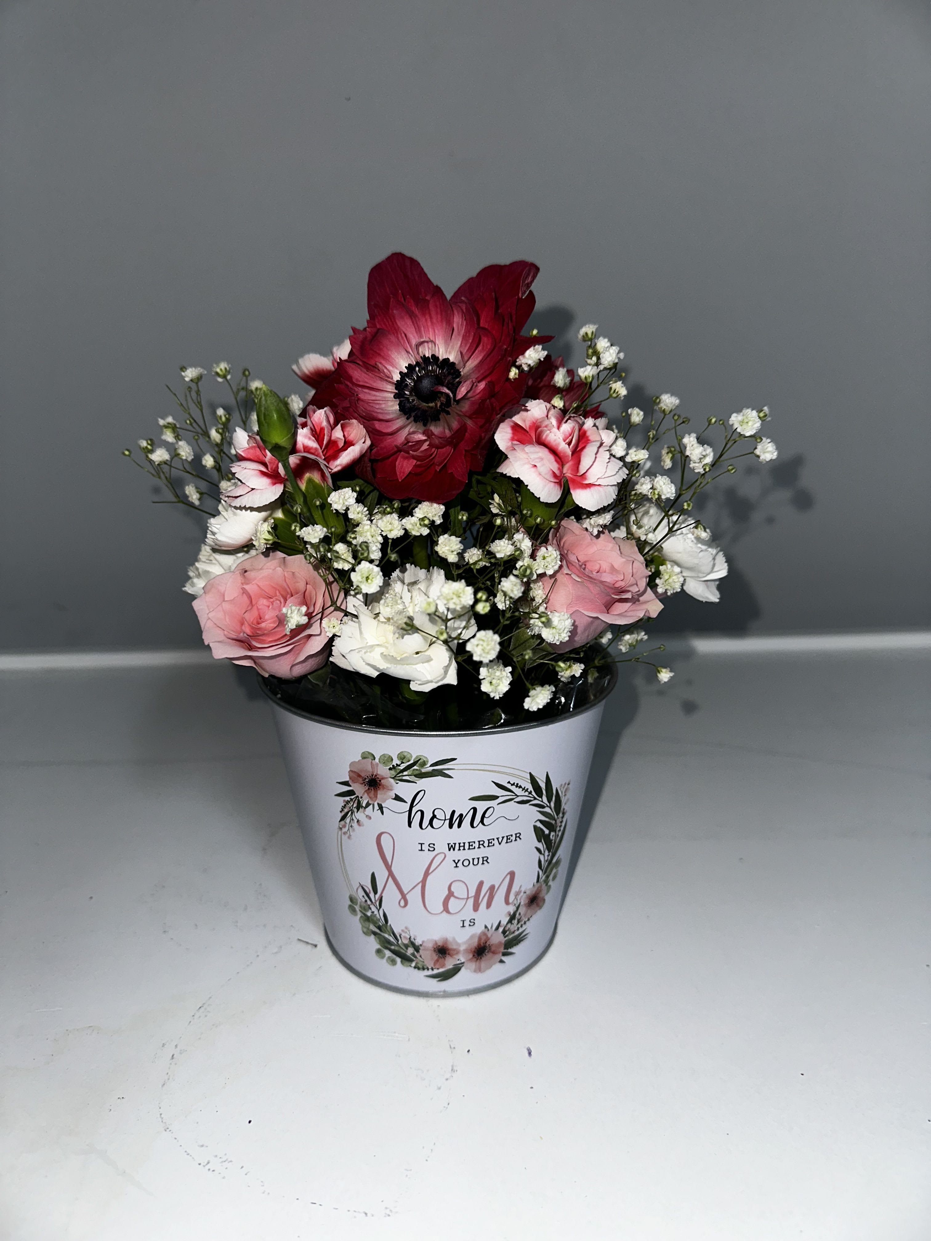 Bucket full of love  - Surprise Mom this Mother’s Day with a beautiful bucket of flowers!  Perfect for showing her just how much she means to you. Order now and make her day extra special!
