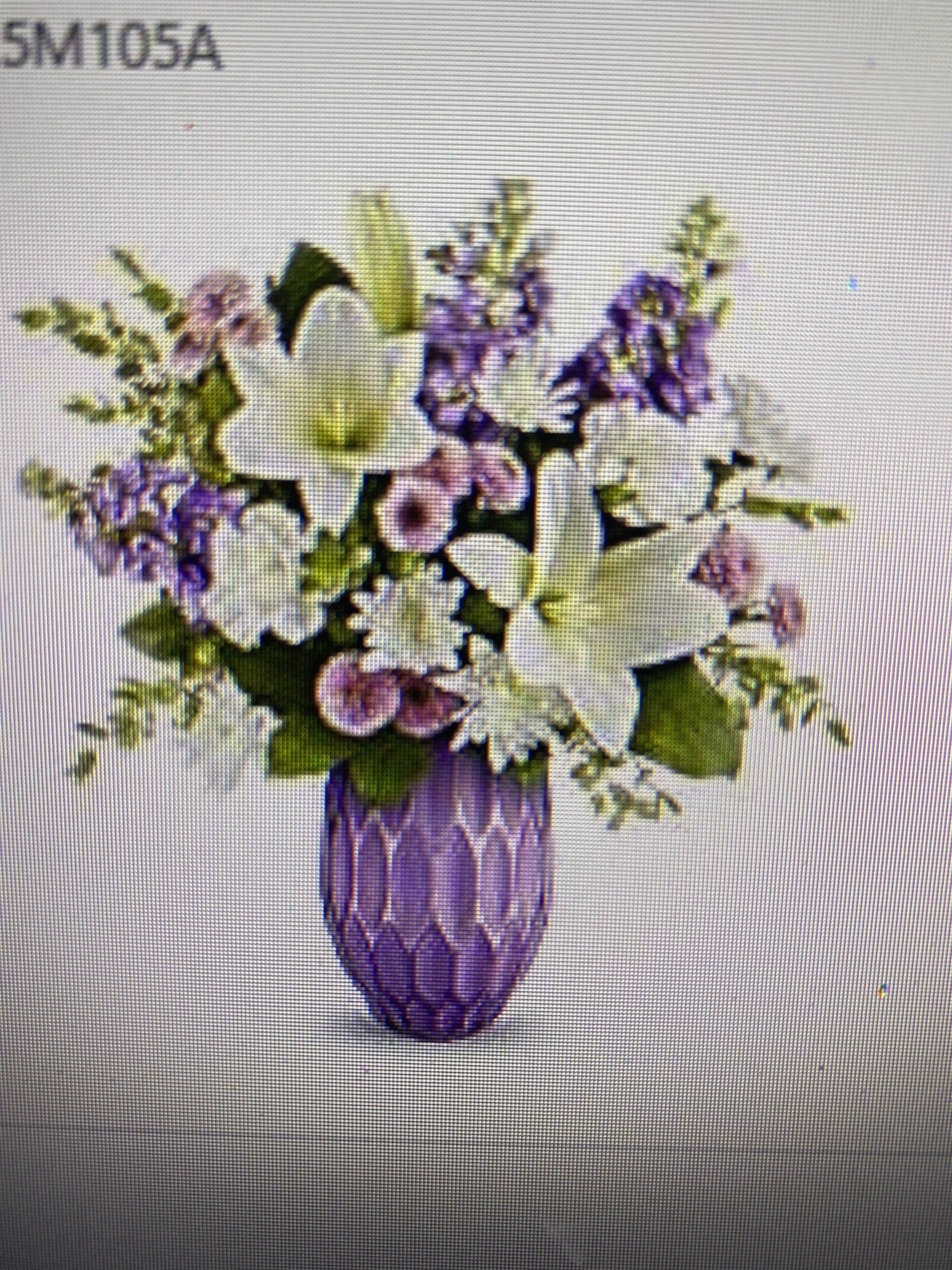 Exclusive bouquet - Celebrate Mother's Day in style with Teleflora's Lovely Pastels Bouquet, featuring a gorgeous lavender mercury-inspired sculpted glass vase filled with elegant white lilies, white carnations, lavender stock, and other beautiful blooms-a timeless and glamorous gift she'll adore. 1 stem lilies, asiatic, white | 2 each carnations, white | 3 each stock, lavender | 2 stems chrysanthemums, button spray, lavender | 1 stem chrysanthemums, cushion spray, white | 1/2 stem parvifolia eucalyptus | 1/2 stem salal