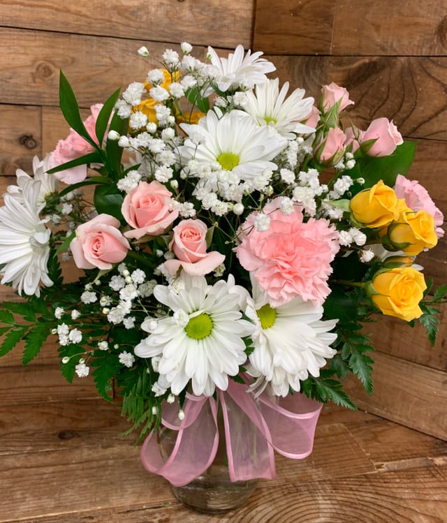 Pink Lemonade Pink Lemonade - A light and lovely bouquet that’s sure to catch their attention with colorful fresh blooms that say thanks, congratulations, or just thinking of you. Arrangement includes pink carnations, white daisies, pink and yellow spray roses, baby’s breath, and greenery.