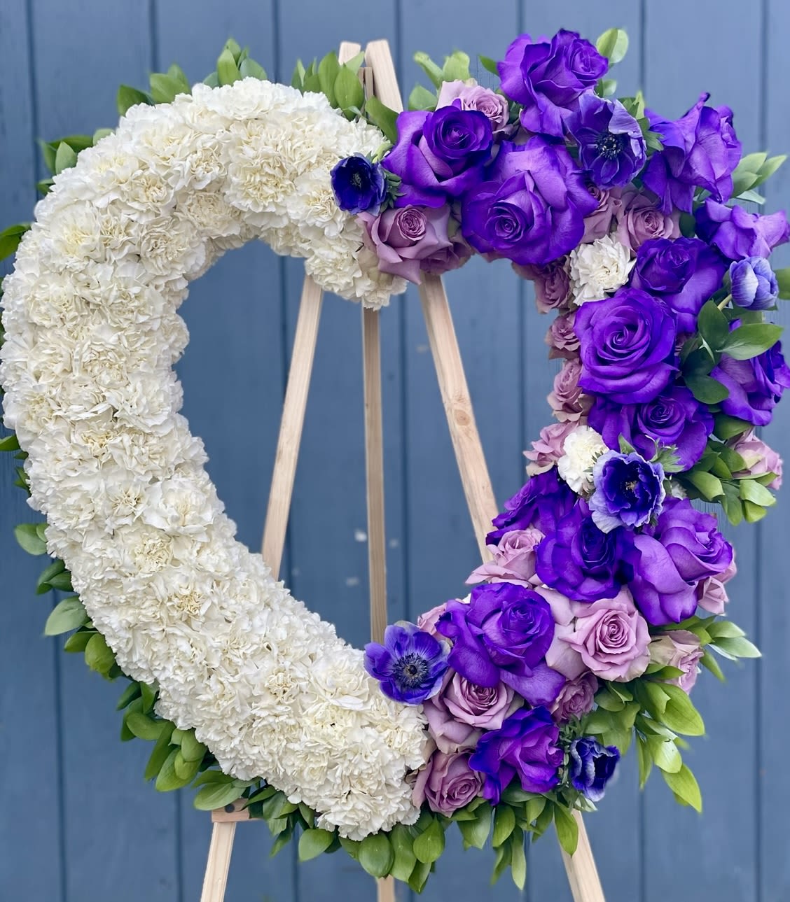 May your love carry on May your love carry on - This beautiful arrangement is made with love. This purple Anemone, specialty roses, and lavender roses exuberant peaceful vibes