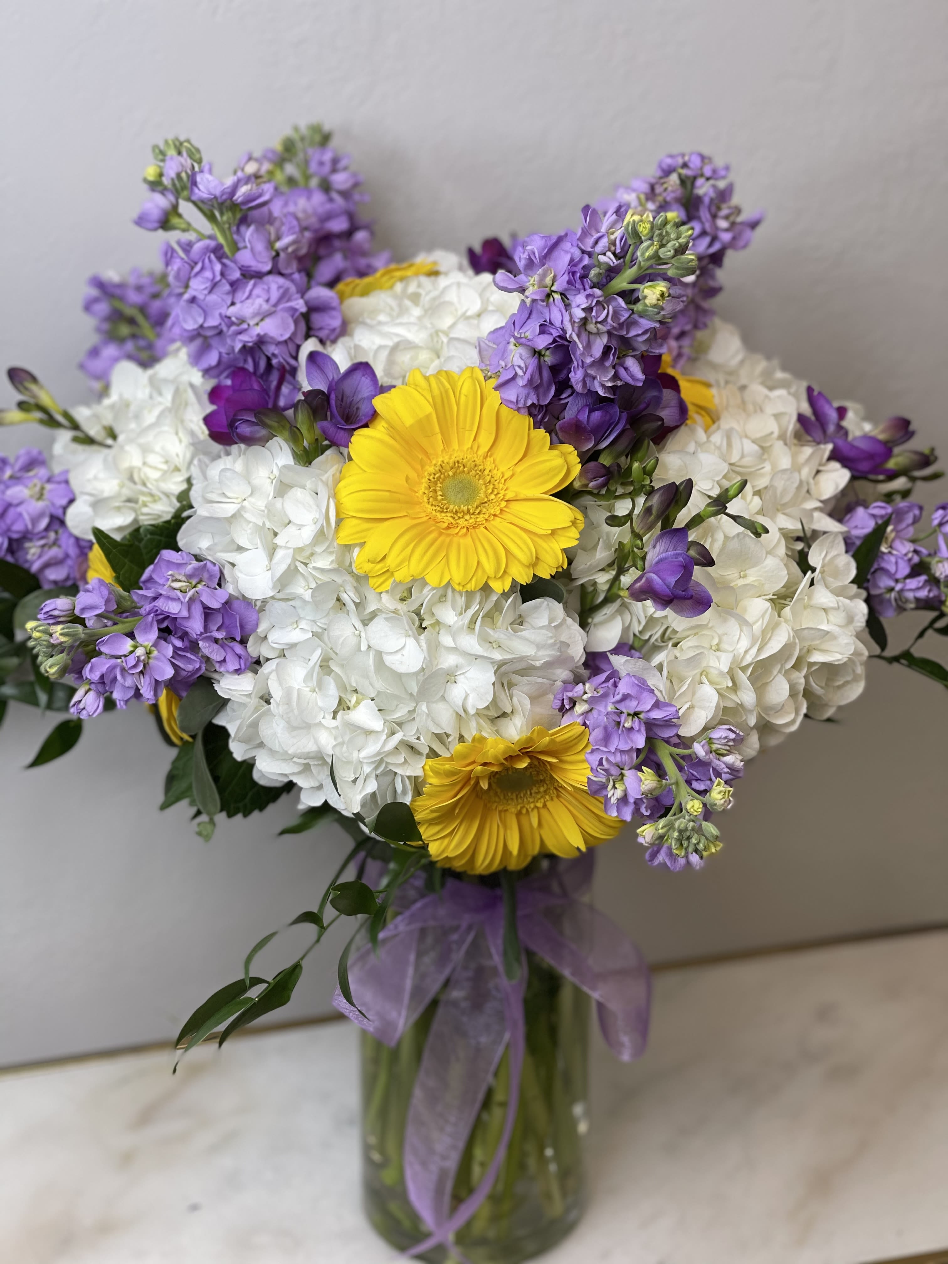 Lavender sunshine Lavender sunshine - Send a sprinkle of magic with this enchanting arrangement. Perfect for anyone special who deserves a little happiness.