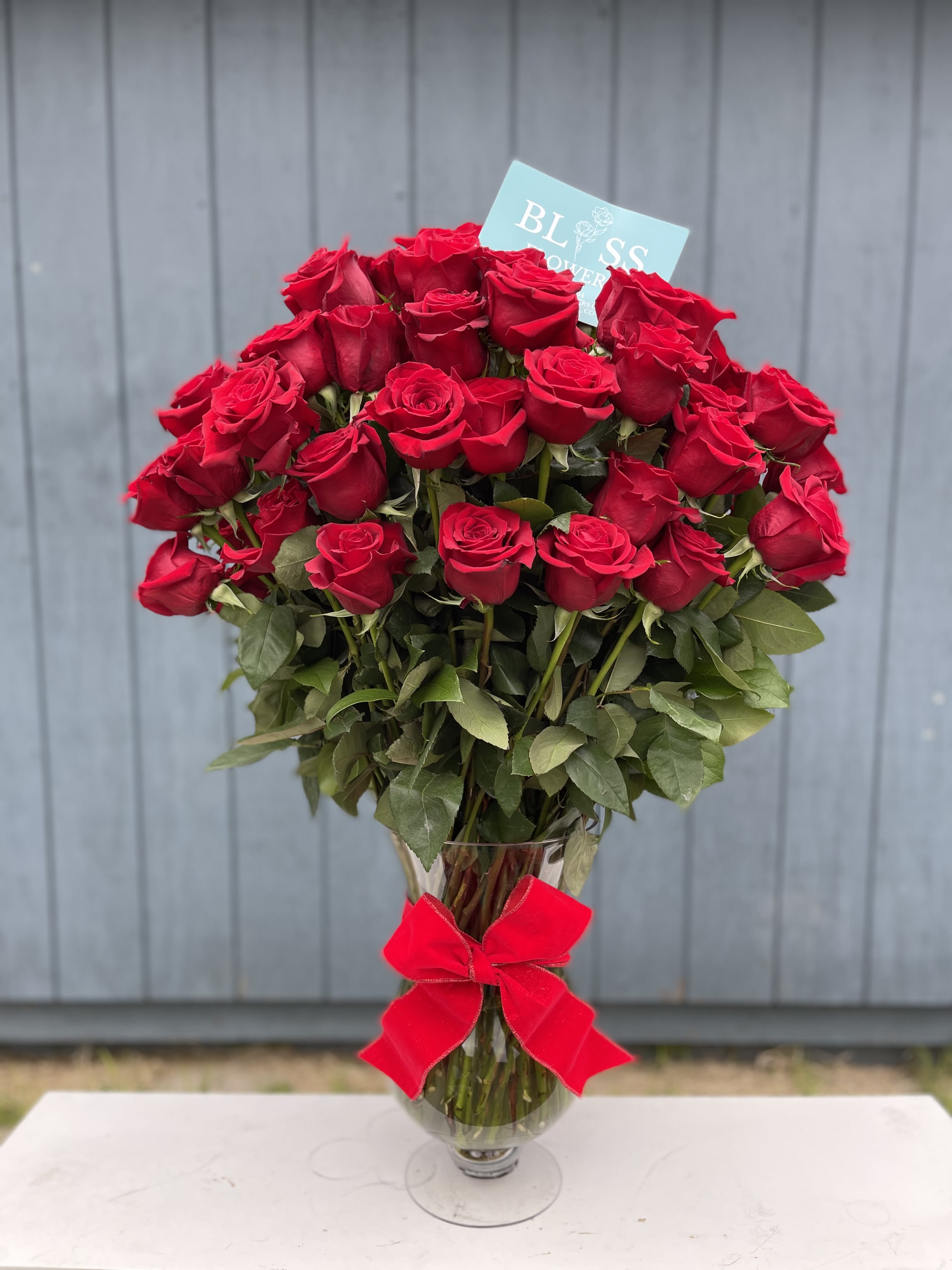 100 stunning red roses for her 100 stunning red roses for her - 100 roses in a vase will be sure to give anyone immense joy.