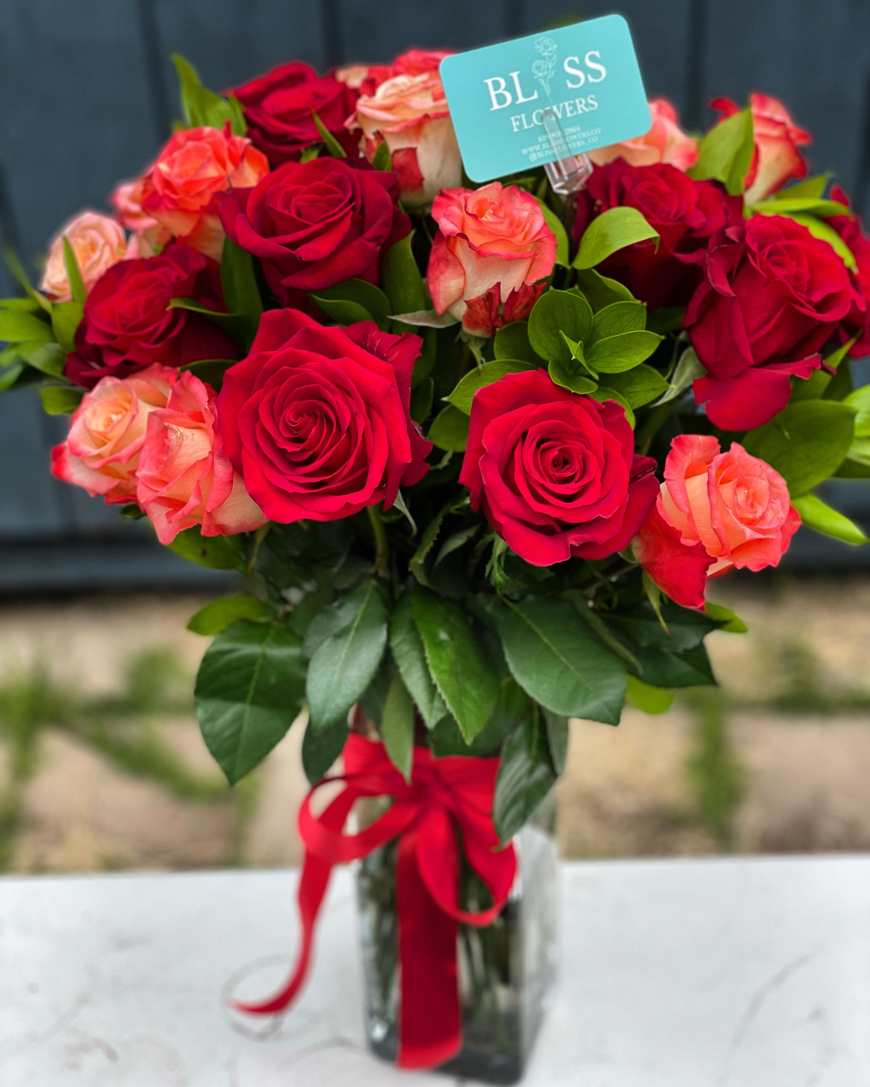 Radiance of Ropss Radiance of Ropss - Mix of red roses + Greenery