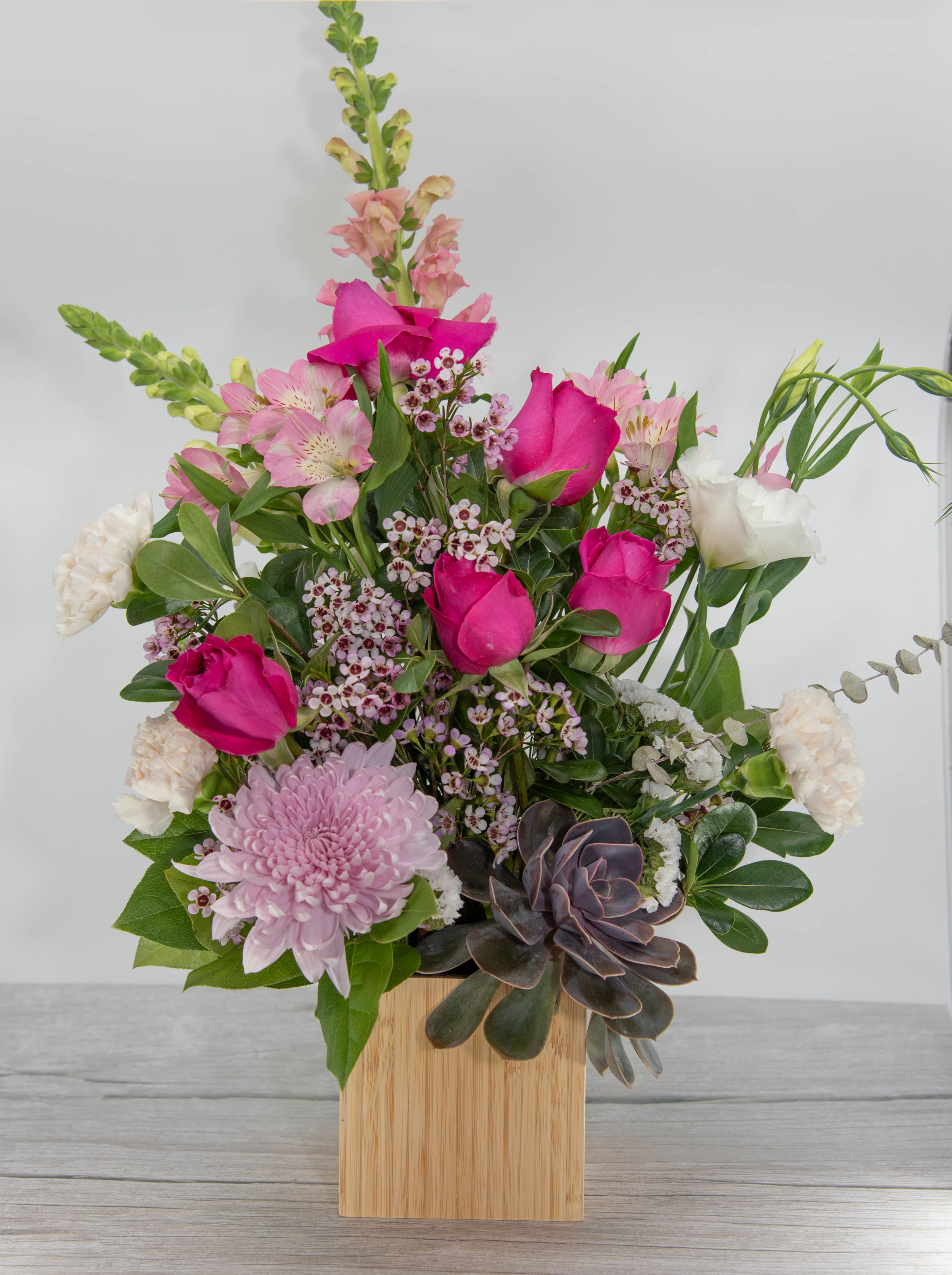 Napa Sunrise - Arden Road Signature Design - The Napa Sunrise flower bouquet is a beautiful bouquet that features roses and a succulent. Deluxe and Premium will be a larger and include more roses.
