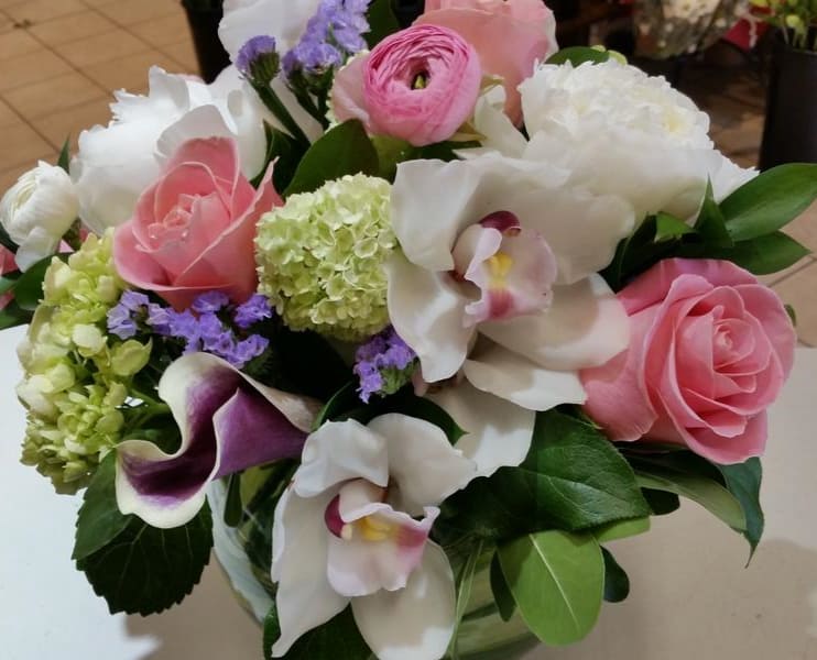 My Lady My Lady - Classy, lovely, and especially feminine. This bubble bowl vase arrangement featuring white Cymbidium orchids, pink ranunculus, calla lily and the perfect shade of roses makes a statement for the lady in your life. Only the finest orchids and upscale blooms come together in our My Lady design.