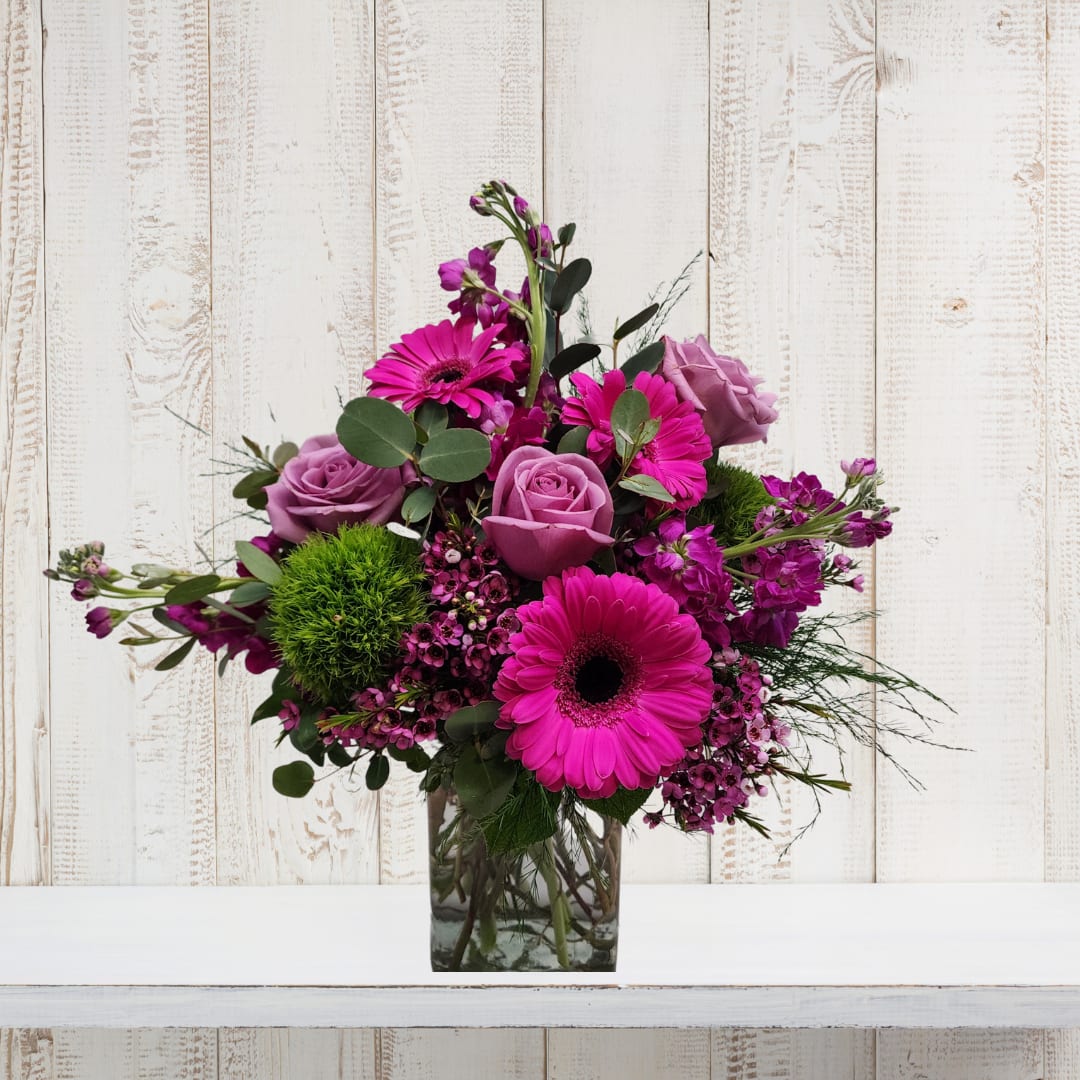 Sweetness Sweetness - Discover Sweetness, an enchanting floral masterpiece crafted by Specialty Floral Design in Olympia, WA. This exclusive custom flower arrangement is meticulously designed to enchant hearts and infuse joy into every moment. Conceived by our skilled design team, Sweetness is a delightful celebration of timeless garden allure, re-envisioned in a harmonious blend of enchanted pinks and purples. Ideal for birthdays, anniversaries, or those "just because" moments, Sweetness is the perfect choice. Whether you're on the lookout for the ultimate birthday bouquet, a romantic anniversary surprise, or a thoughtful gesture to express your affection, Sweetness guarantees to be the answer. Every Sweetness arrangement is a unique masterpiece, meticulously crafted with the freshest seasonal blooms. Our distinctive style embraces the ever-changing tapestry of nature, ensuring that each creation is an unparalleled expression of floral artistry. Envision a canvas adorned with delicate pinks and purples, seamlessly blended with the freshest seasonal flowers, including Roses, Stock, Gerbera Daisies, Dianthus, and other seasonal floral delights. Spread the sweetness right away! We understand that sometimes the perfect gift deserves immediate delivery. That's why Sweetness is available for same-day delivery, bringing a burst of sunshine to your loved ones in Olympia, WA, and surrounding areas, including Lacey, Tumwater, Yelm, Shelton, Tenino, Centralia, and Chehalis.