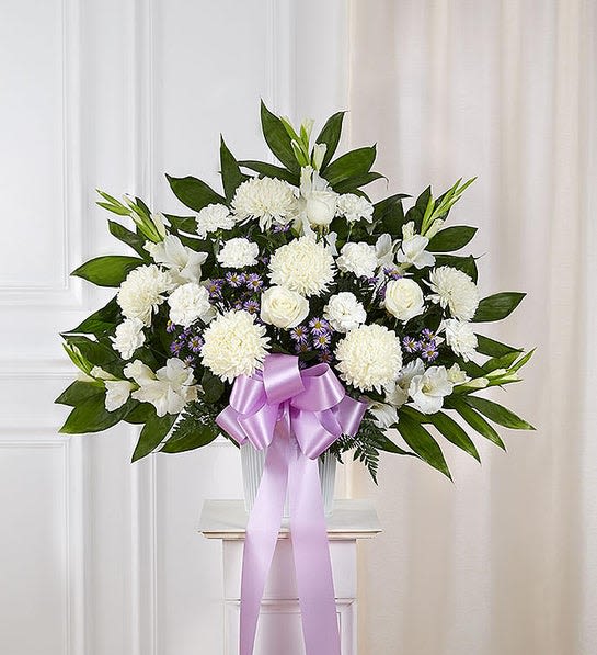 Heartfelt Sympathies Lavender &amp; White Standing Basket - Standing basket arrangement with white roses, football mums, stock and carnations; lavender monte casino; purple liatris; accented with soft, lush greenery and lavender bow 