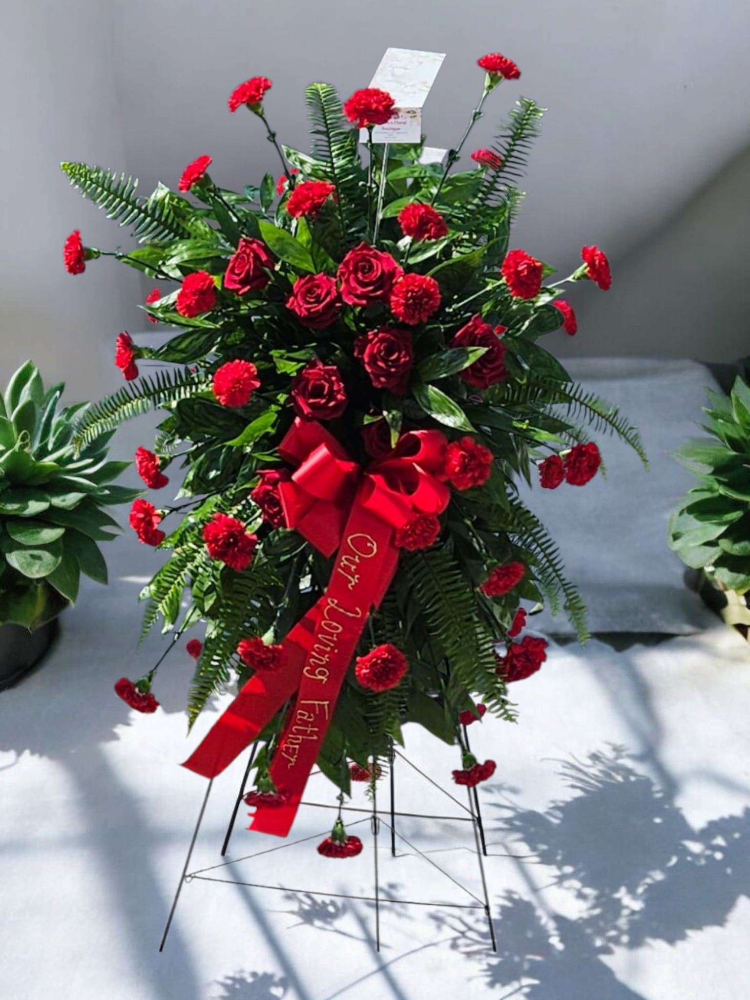 red sympathy red sympathy - Red roses with red carnations to create this one color sympathy spray