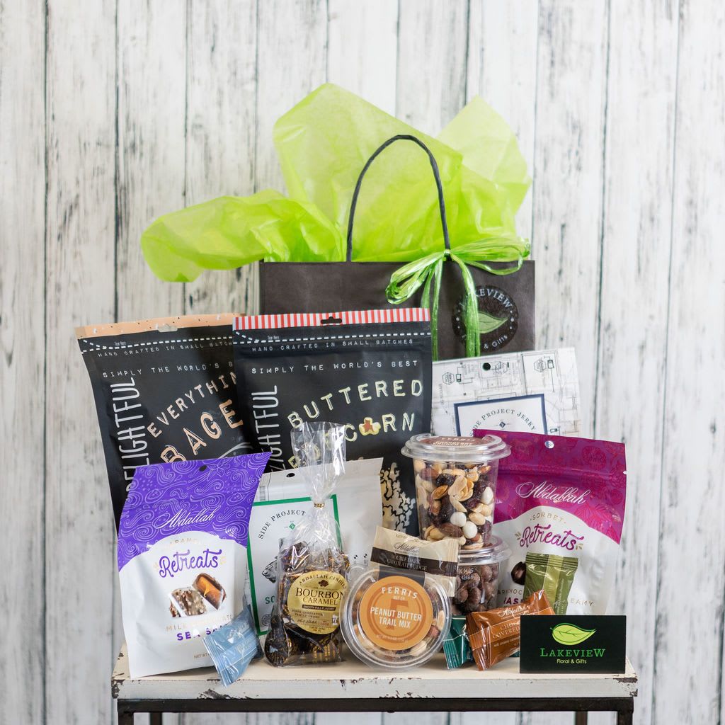 Yum! - Great for the whole gang (or just 1 super special someone!) a snack basket contains an assortment of gourmet popcorn, locally made chocolates, jerky, assorted trail mixes and nuts.  Our team chooses specially selected treats to complete this gift!