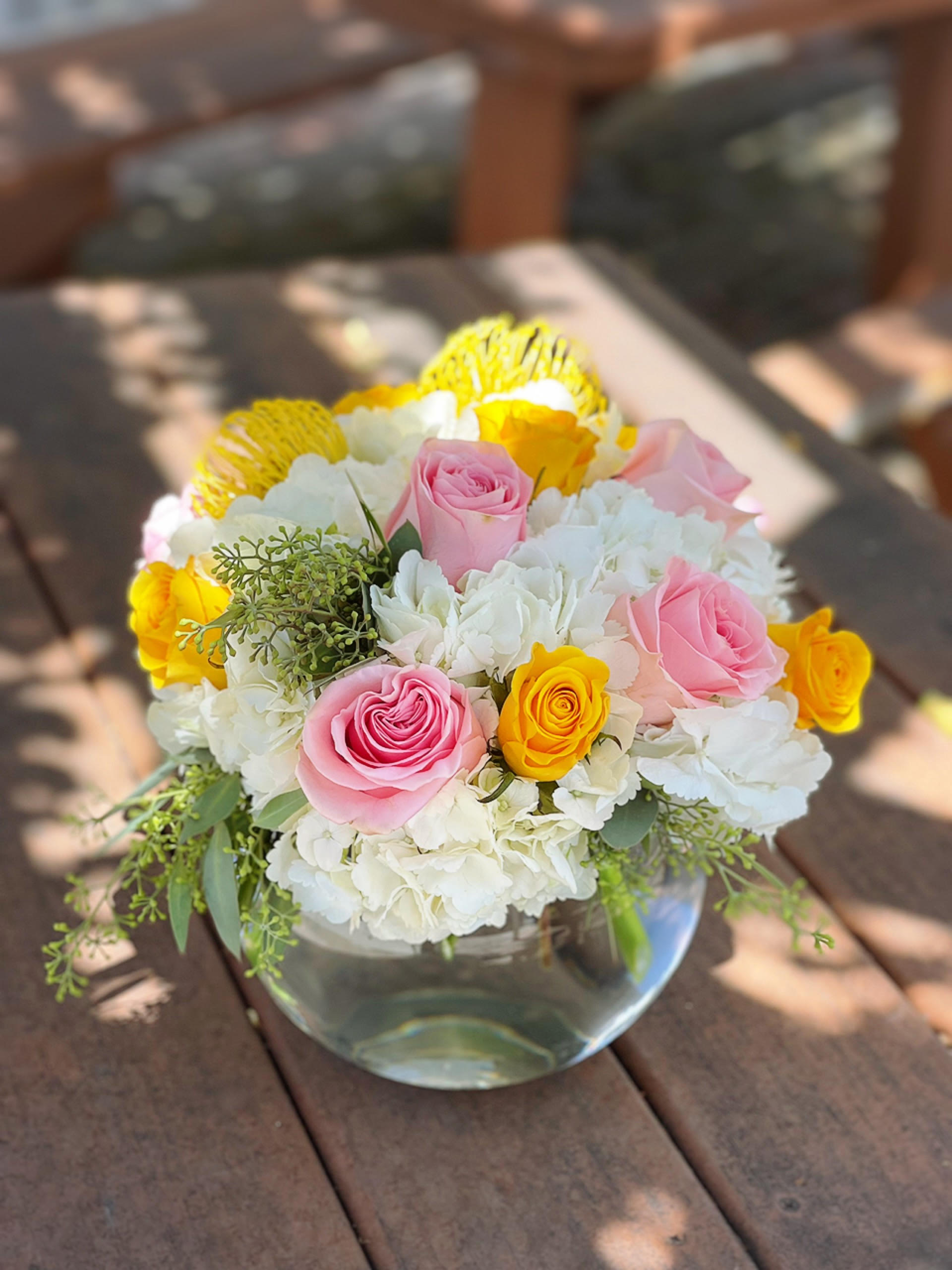 Hello My Love Hello My Love - - 2 Stem Proteas - 3 White Hydrangeas - 3 Pink Roses - 3 Yellow Roses - Greenery - 8 Inches Bubble Vase