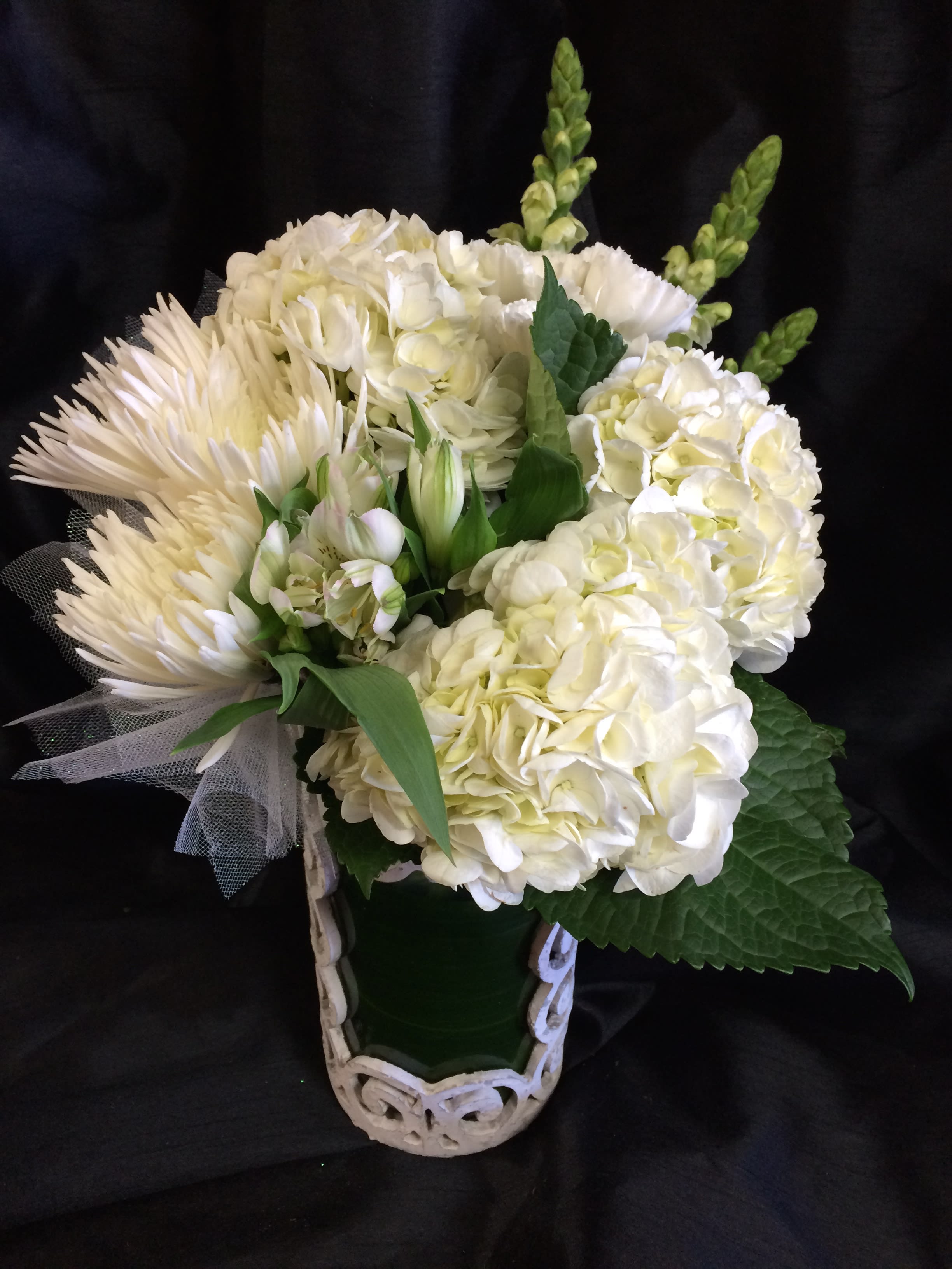 White Elegance - Our best white flowers arranged artfully in a lovely keepsake vase.