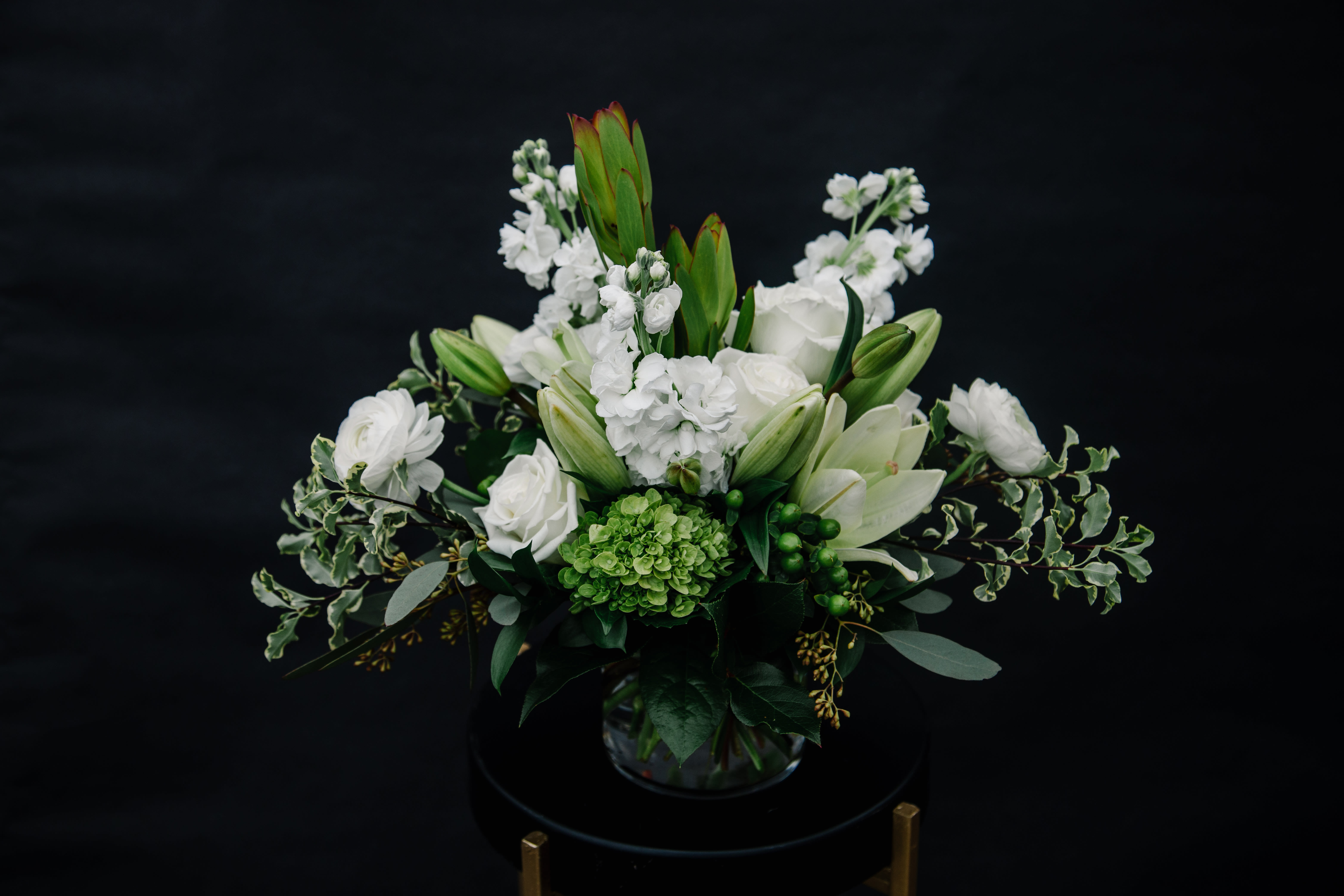 Beautiful Blooms Beautiful Blooms - Convey your thoughts with our elegant bouquet in mixed shades of whites. This stunning bouquet includes an assortment of lilles, roses, ranunculus and fragrant stock.