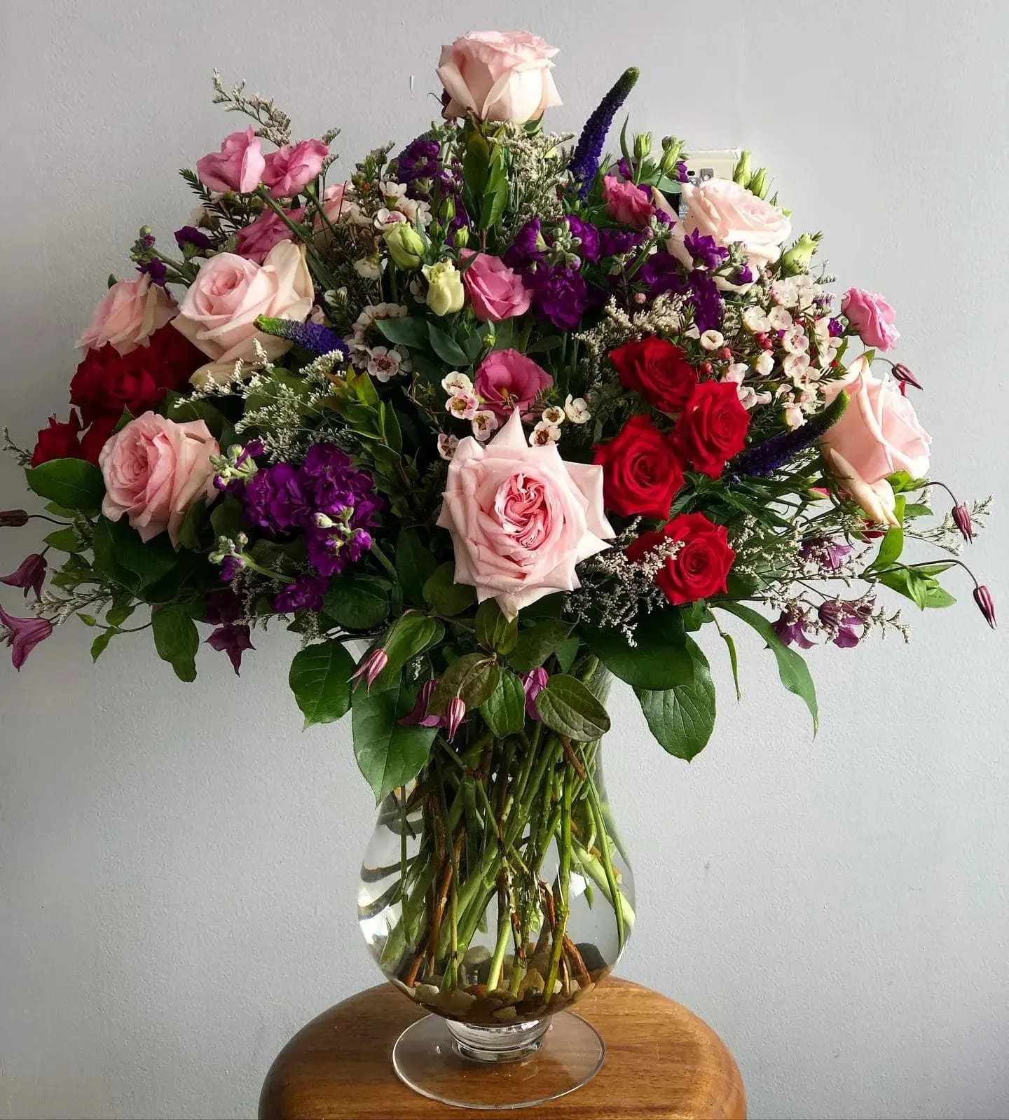 The Anastasia by Simply Fresh Flowers - The Anastasia is an all sided showstopper, designed in a lovely pedestal vessel. It boasts an abundance of fragrant garden roses, lisianthus, spray roses, stock, veronica &amp; a plethera of other seasonal  blooms. Simply sensational &amp; meant for someone very special! 