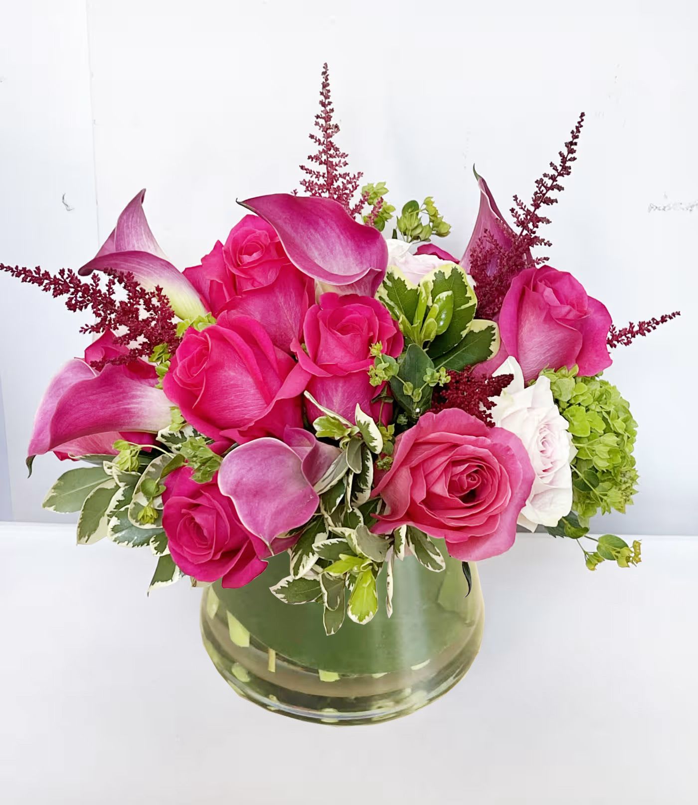Hey Barbie Hey Barbie - This pink arrangement features hot pink and pastel pink roses, accented with pink calla lily, green hydrangeas and other pink filler flowers