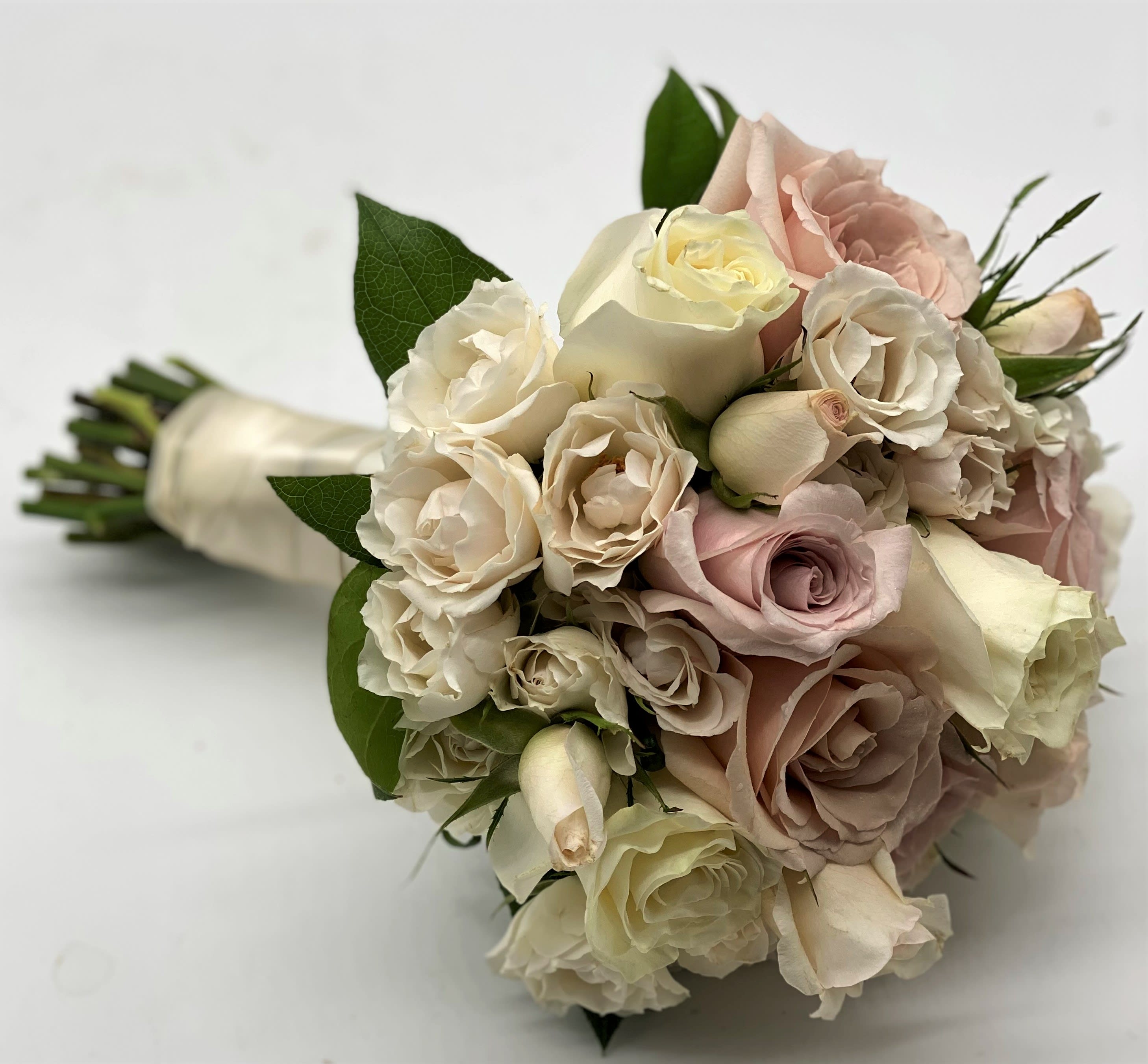 The Antique Beauty Clutch Bouquet - A mix of dusty pinks, creams and lavenders gives this bouquet a beautiful antique vibe!