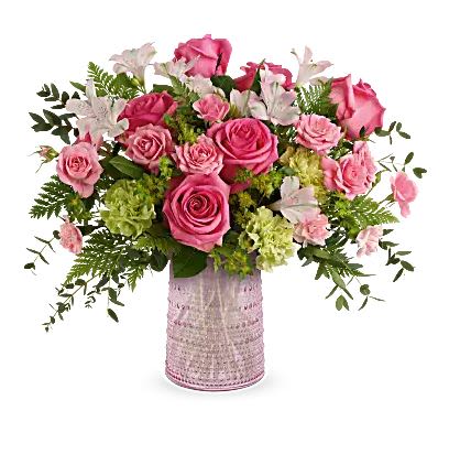 Sparkling Joy Bouquet - Bouquet-hot pink roses, pink spray roses, light pink alstroemeria, green carnations, pink miniature carnations, bupleurum, leatherleaf fern, and parvifolia eucalyptus-artfully arranged in the food-safe pink glass carafe with elegant beaded details, a cherished gift for Mom.  Great arrangement to get your loved ones for Mother's Day