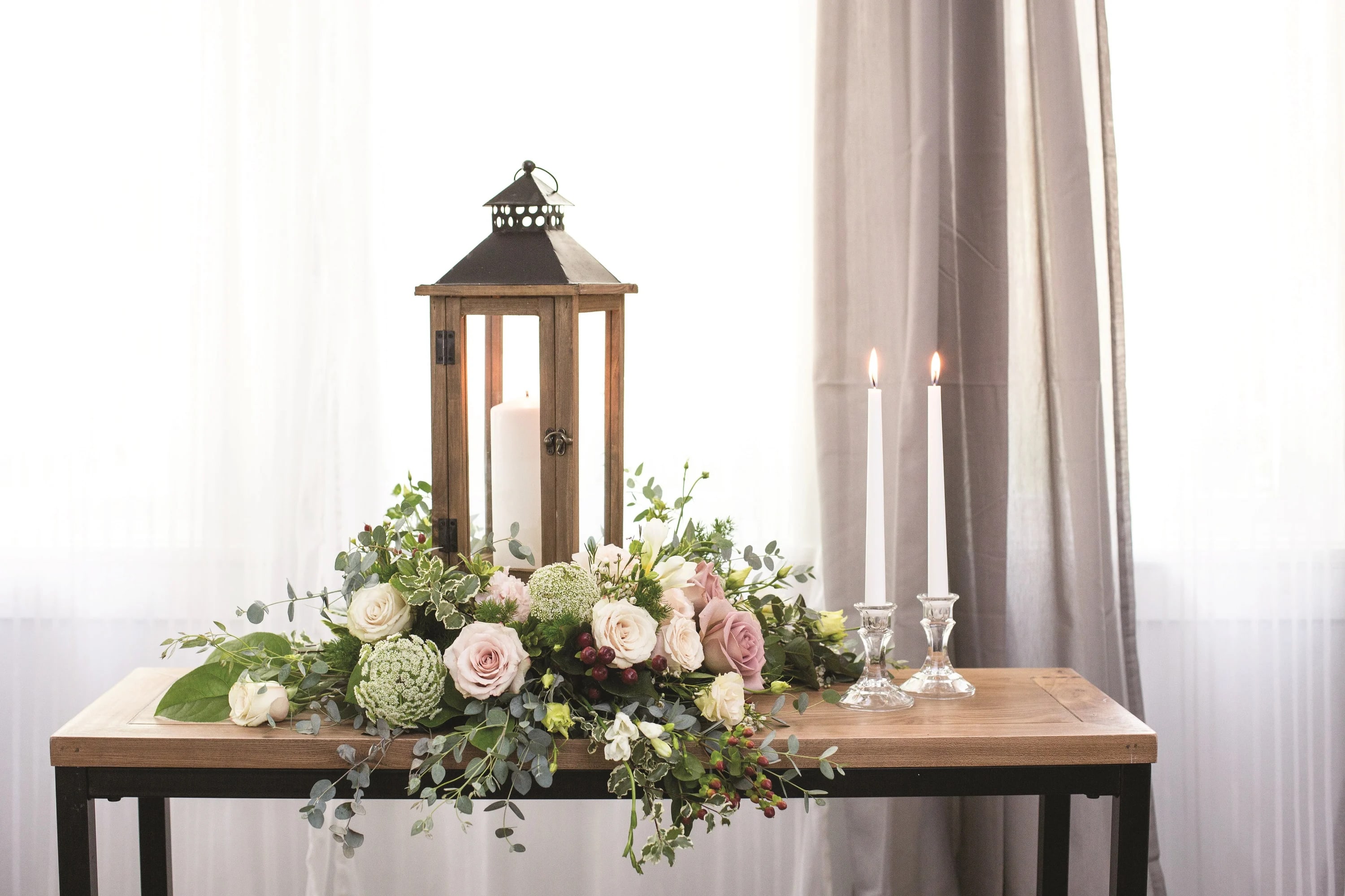 Tranquility Tranquility - "Tranquility," is a captivating floral arrangement meticulously crafted to evoke a sense of peace and serenity, enveloping the soul in a gentle embrace. Just as "Peace & Light" illuminates the heart, "Tranquility" seeks to soothe and comfort in moments of quiet contemplation. We have curated an arrangement that speaks volumes without uttering a single word. Each bloom and leaf is thoughtfully selected to convey a message of tranquility and affection, transcending the limitations of language. At the heart of "Tranquility" lies a softly glowing lantern, casting a comforting light that illuminates the delicate beauty of the surrounding flowers. Like a beacon of hope in the darkness, the flickering candle flame symbolizes inner peace and inner strength, guiding the spirit towards a place of calm and solace. Please be mindful that the floral selection in "Tranquility" may vary depending on local and seasonal availability. Nevertheless, our dedicated team will ensure that each bloom is chosen with care, preserving the essence and aura of the arrangement. While individual flowers may change, the overall ambiance of "Tranquility" will remain steadfast, radiating a sense of grace, elegance, and reverence. As you send forth "Tranquility" to your loved ones, may it serve as a heartfelt tribute, bringing comfort and solace during moments of reflection and remembrance