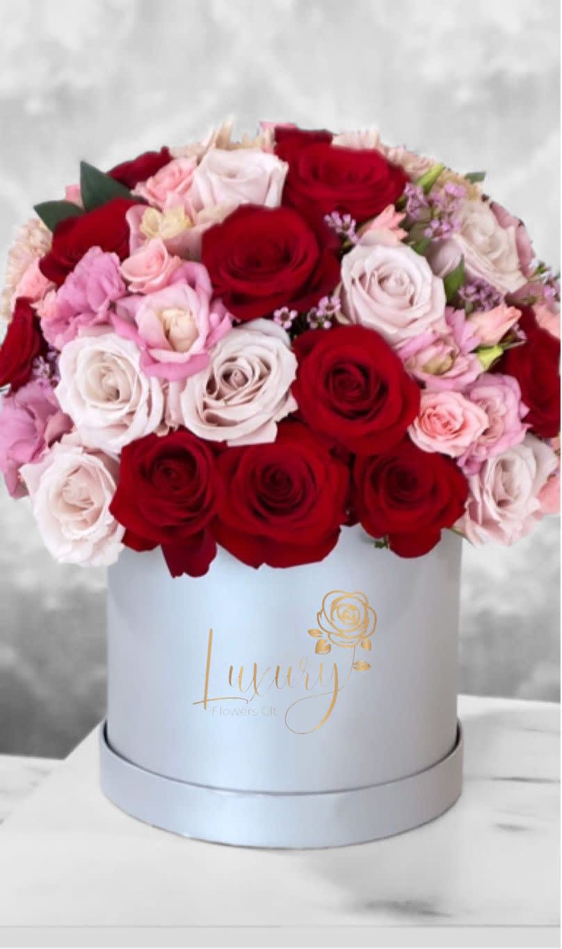 Fiorella Box Fiorella Box - Our exclusive designs of fresh flowers in beautiful round boxes are a true symbol of luxury arrangements for all occasions. All Occasion Roses in Box: 50-55 stems of natural roses. Color Box: White or Black (subject to inventory availability) Place your Order Online Monday to Saturday before 1:00 p.m. (E.T.) for same-day delivery. “Orders received after hours will be delivered the next business day”. Check our coverage area. Occasionally, substitutions of flowers and/or containers happen due to weather, seasonality, and market conditions which may affect availability. If this is the case with the gift you’ve selected, we will ensure that the style, theme, and color scheme of your arrangement are preserved and will only substitute items of equal value or higher value. CARE INSTRUCTIONS Gently mist the arrangement with natural water every other day. Do not spray any cleaning product on the flower arrangement. Do not place heavy objects directly on the flower arrangement. Keep them out of direct sunlight and extreme heat.