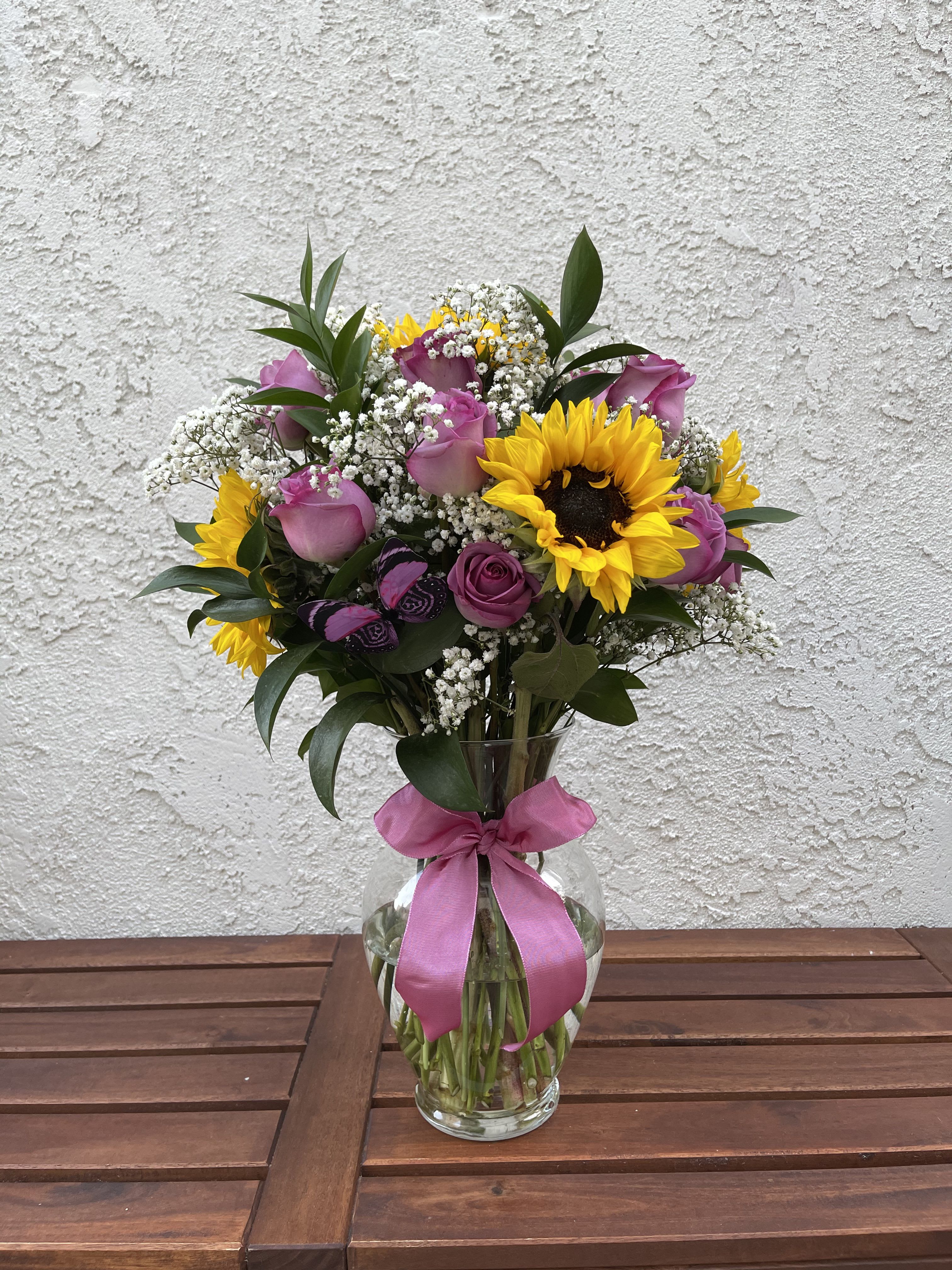 Blooming Cuties Blooming Cuties - This cute lavender rose and sunflower arrangement is sure to bring a smile to anyones face.