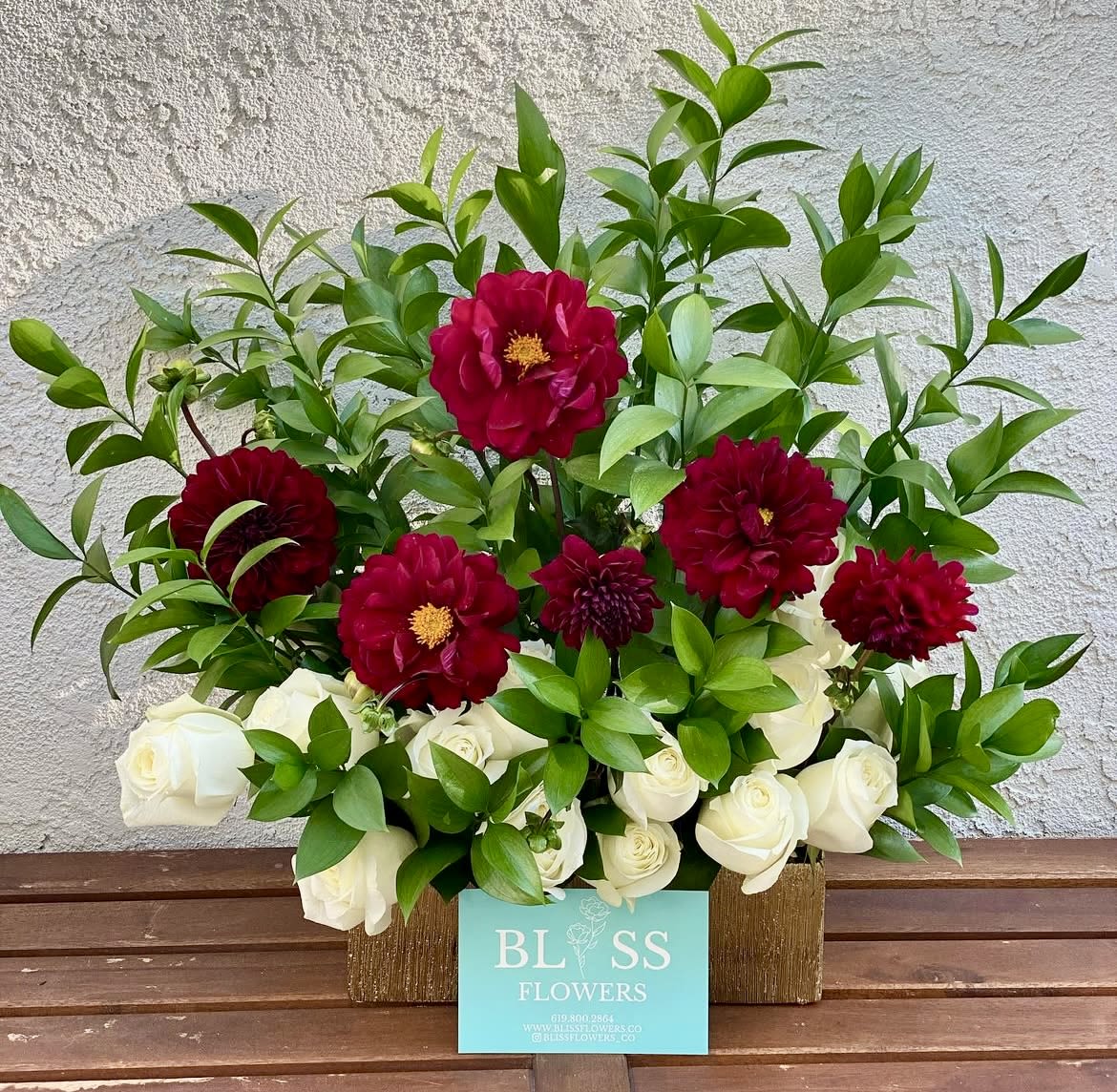 Love me Dahlias Love me Dahlias - This beautiful arrangement of Dahlias, roses and greens in a gorgeous gold or silver vase will draw on smile on anyones face