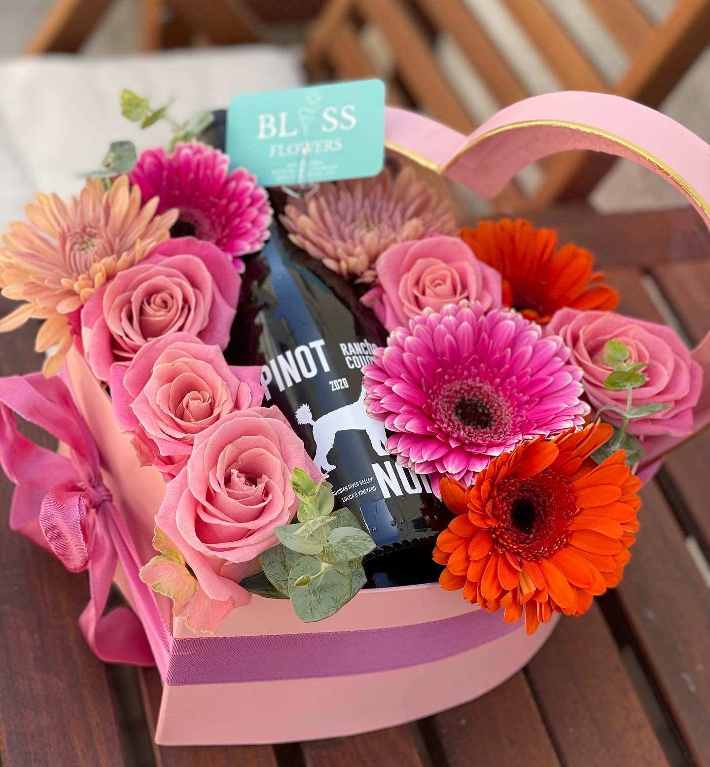 Pedals and vino Pedals and vino - This is a a excellent gift for mom. Lets celebrate Moms with a nice bottle of wine in a beautiful flower box. Please message with any questions or customizations.
