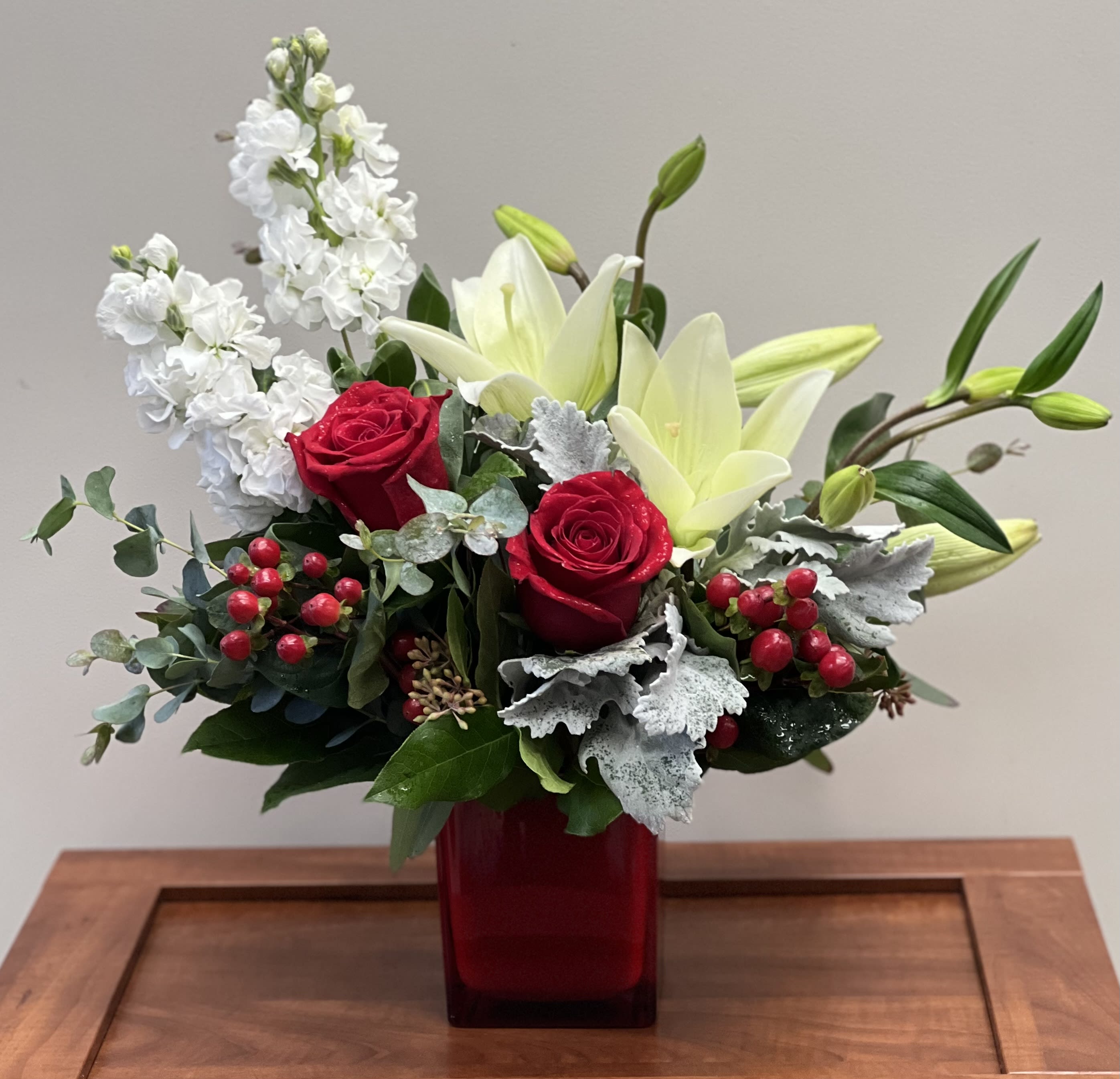 Be Mine - The perfect design for anyone you may want to ask to &quot;Be My Valentine&quot; Red roses, lilies, and fragrant stock artfully designed in a red glass cube accented with a nice variety of greenery and red coffee berries.
