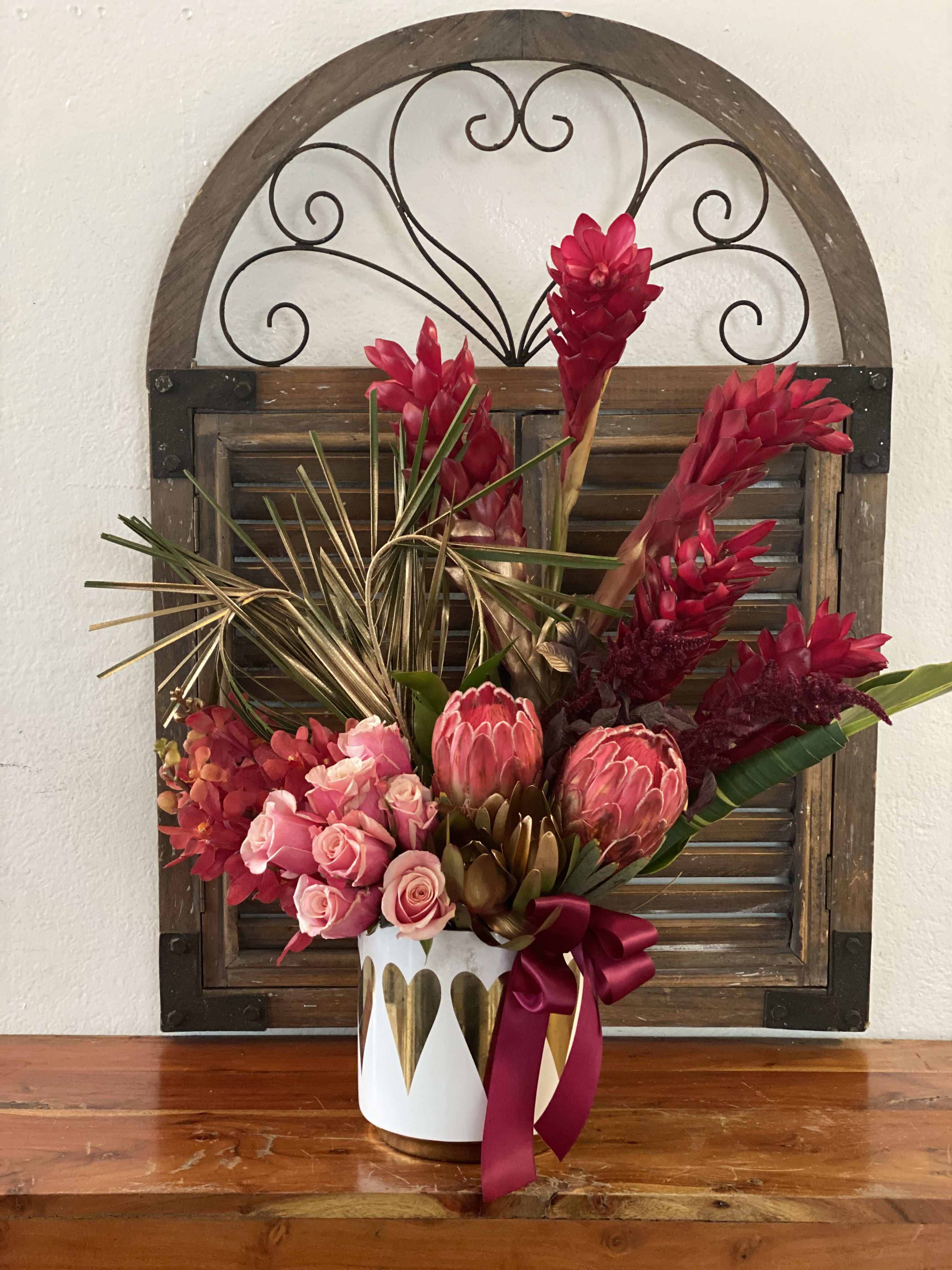 Love in Laguna Beach Love in Laguna Beach - Tropical red and gold arrangement tall and modern in ceramic white vase , specially to celebrate love.