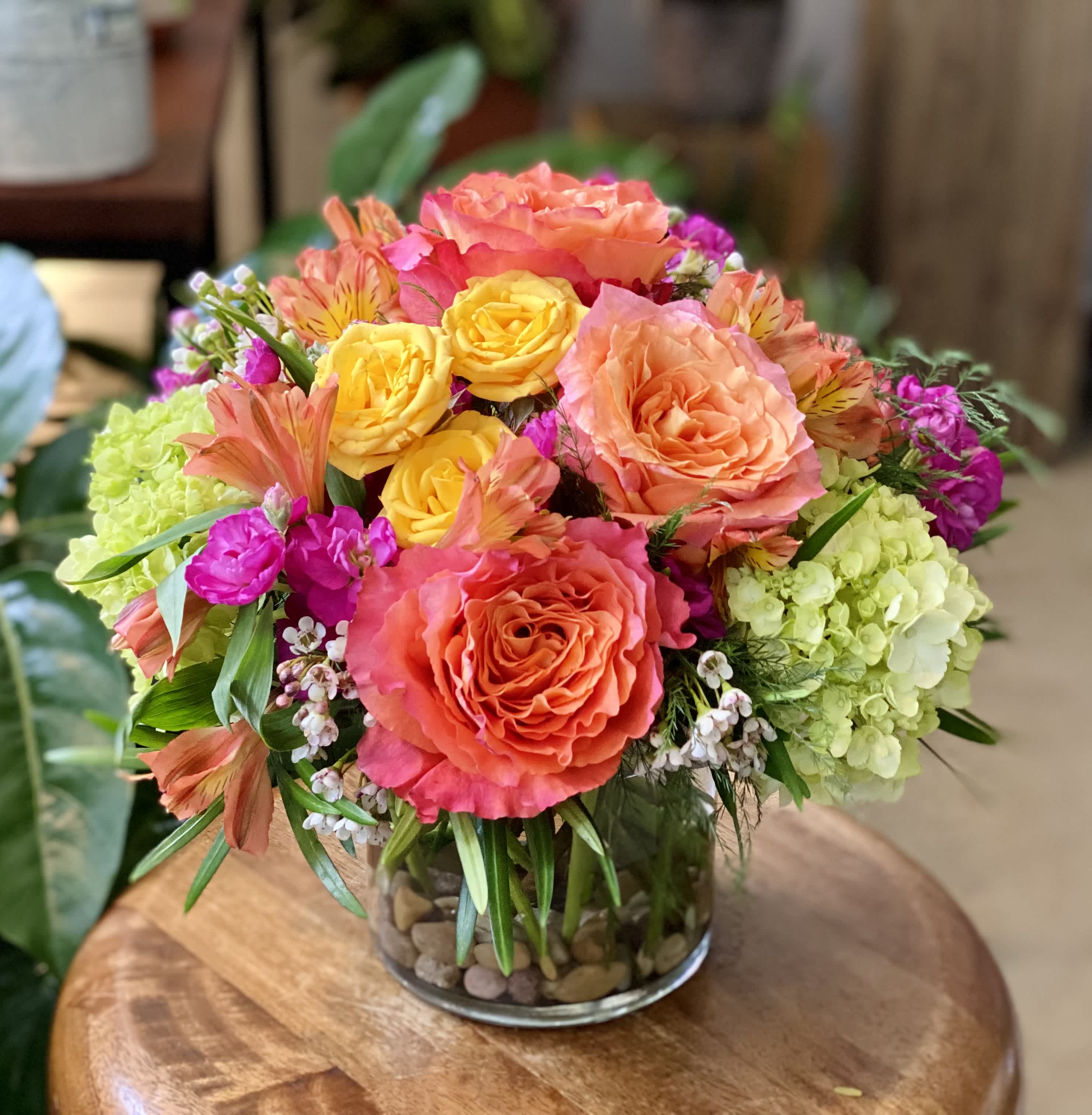 The Lucy by Simply Fresh Flowers - By far, our best selling design, The Lucy is the perfect arrangement to brighten someone's day.  An all sided design, incorporating gorgeous Free Spirit roses, spray roses, mini hydrangea, stock, &amp; alstromeria,