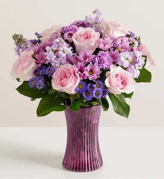 Day Dream Bouquet - An Arrangement of pink and lavender flowers which include pink roses, lavender daisies, purple monte, lavender stock, lavender carnation with some fillers and greens.   Note: Vase is subjected to change if it is not available.