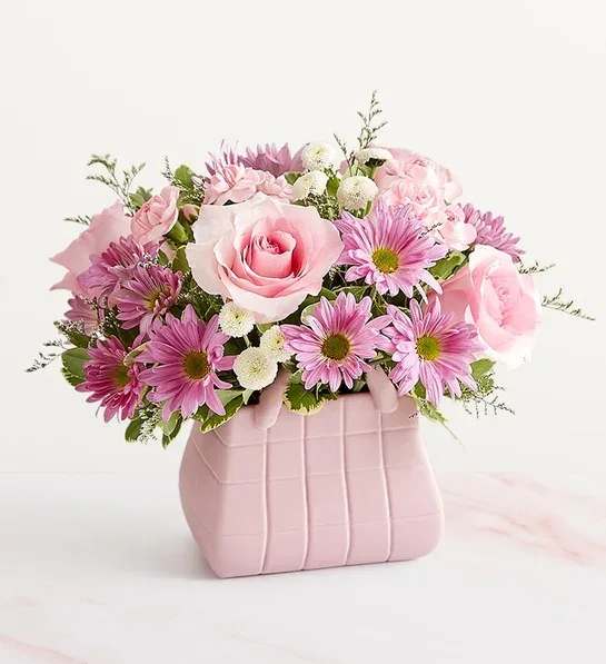 Designer's Dream Bouquet Designer's Dream Bouquet - A beautiful Handbag perfect for mother's day filled with pink roses and lavender daisies along with some fillers and greens