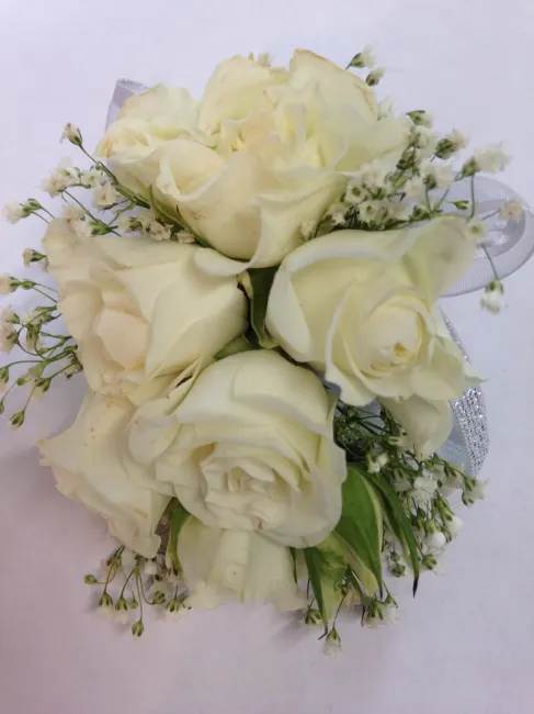 white spray rose Corsage white spray rose Corsage - white spray roses with seasonal garnish wrapped with sheer ribbon. can be different color please specify .