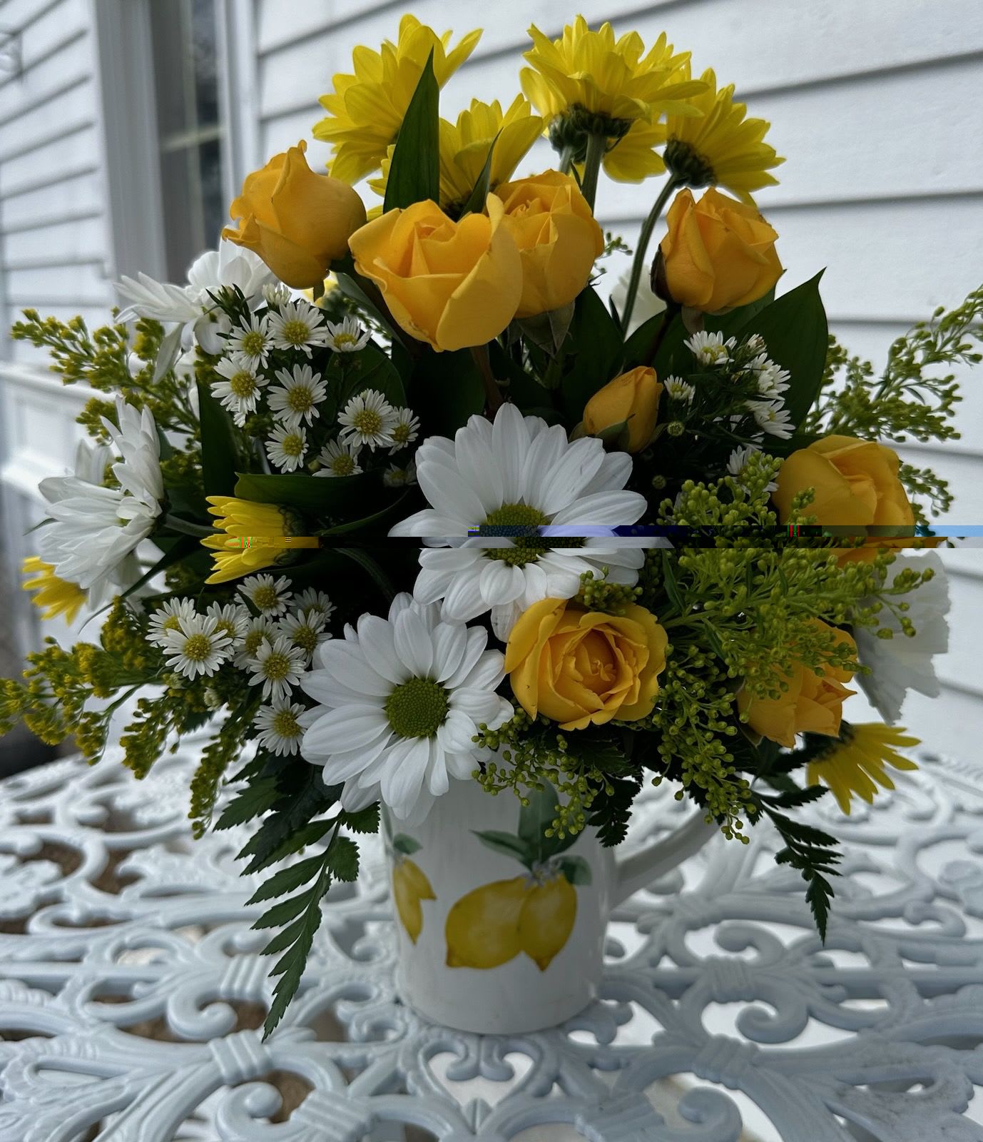 Coffee Break Bouquet -  Yellow spray roses, white daisys, wellow chrysanthemums, solidago and white monte arranged in a cheery coffee mug.