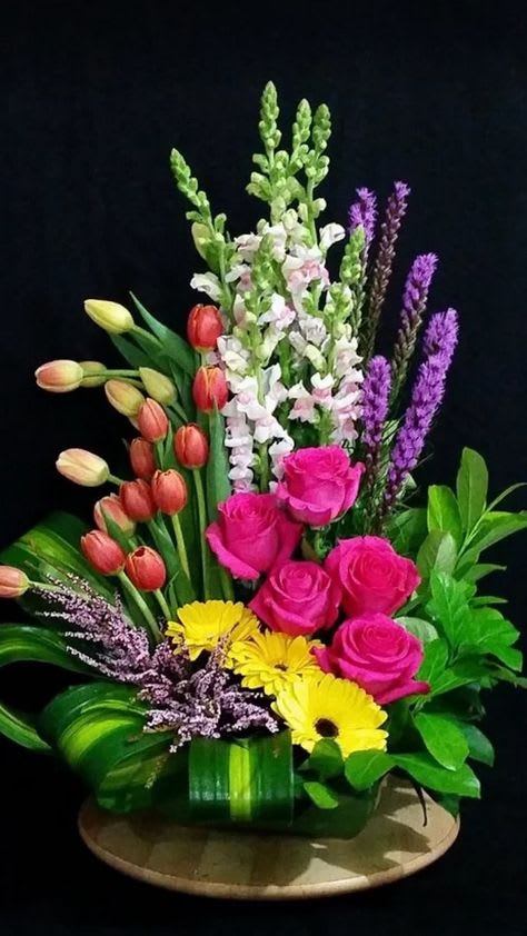 European Clustering Garden Luxury Bouquet European Clustering Garden Luxury Bouquet - A Beautifully artistic display of flowers arranged in a European influenced design. This upscale arrangement is a perfect way to send comforting thoughts. Flowers will vary according to season.