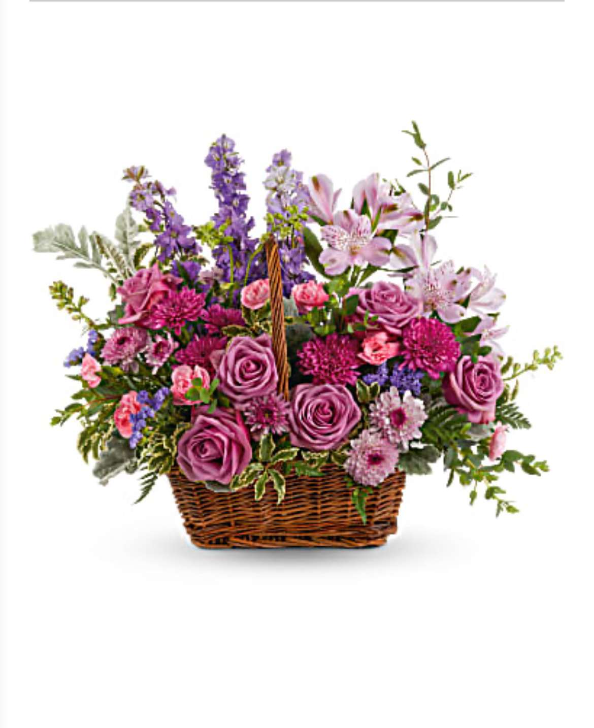 Spring is in the Air - A basket filled with a variety of spring flowers  perfect for a coffee or dinning table