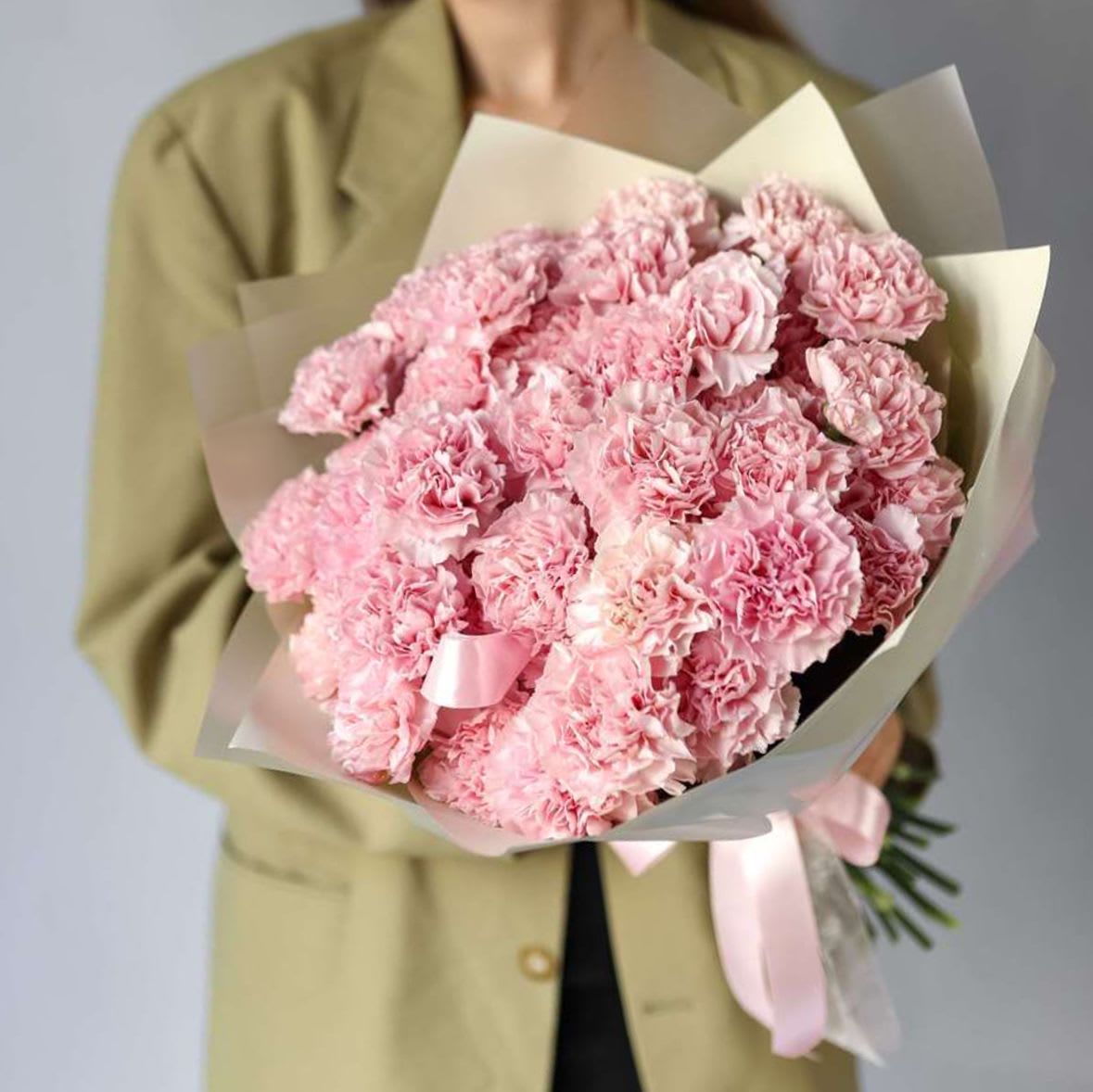Pink Carnation - A cute bouquet of fresh carnation, perfect for any occasion. Wrapped in matte film and tied with a ribbon. This elegant arrangement is sure to impress. Delivered in an aqua box for ultimate freshness.