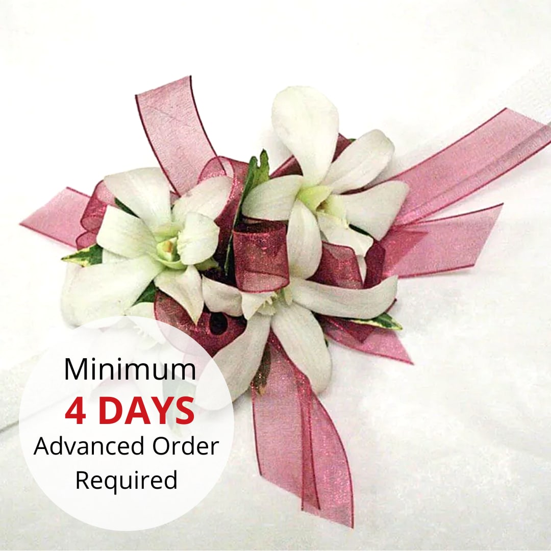 Dendrobium Orchid Wristlet - Elevate your formal look with our contemporary wristlet featuring elegant Dendrobium orchids. Perfect for special occasions, this wristlet adds a touch of sophistication and charm.   Key features include:  Elegant Design: Showcasing beautiful Dendrobium orchids, this wristlet is perfect for a chic and stylish appearance.  Comfortable and Lightweight: Designed to be non-bulky, ensuring comfort and ease of wear throughout your event.  Customization Options: Available in various flower and ribbon colors. Please help us fulfill your order more accurately by stating the color of the flower and the color of the ribbon in the special instructions during checkout.  Advance Ordering: Due to the intricacy of this piece, please place your order 2 days in advance.  Inquiries: If you wish to ask about our color options, please call 808-832-9360.  Enhance your formal ensemble with our Contemporary Formal Wristlet, a sophisticated and refined accessory for any special occasion.