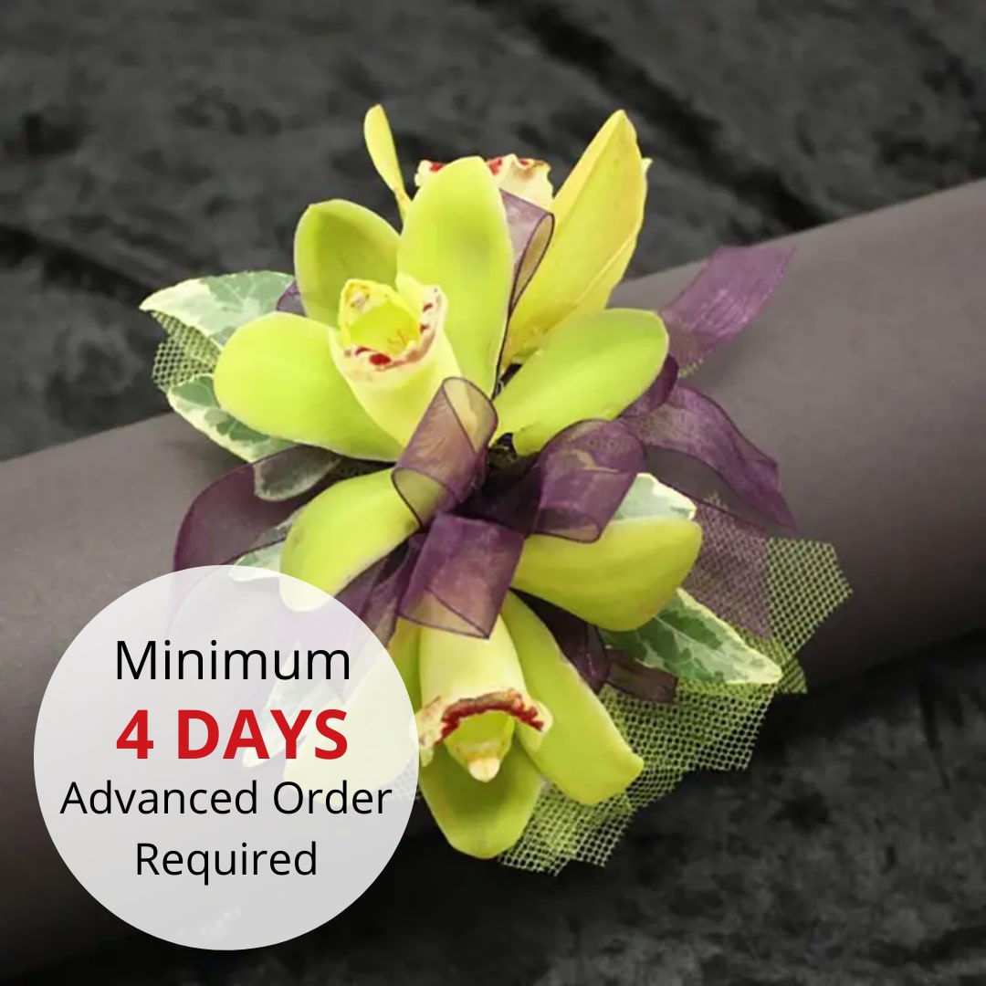 Mini Cymbidium Orchid Wristlet - Stylish Tropical Wristlet for Prom.  Make a statement at prom with our stylish tropical wristlet. Designed to capture the vibrant beauty of the tropics, this wristlet is a perfect accessory for a memorable night.  Key features include:  Tropical Elegance: Featuring exotic tropical flowers, this wristlet adds a unique and colorful touch to your prom look.  Lightweight and Comfortable: Designed to be non-bulky, ensuring comfort and ease of wear throughout the night.  Customization Options: Available in various flower and ribbon colors. Please help us fulfill your order more accurately by stating the color of the flower and the color of the ribbon in the special instructions during checkout.  Advance Ordering: Due to the intricacy of this piece, please place your order 2 days in advance.  Inquiries: If you wish to ask about our color options, please call 808-832-9360.  Celebrate prom night with our Stylish Tropical Wristlet, a vibrant and elegant accessory that will make your evening unforgettable.