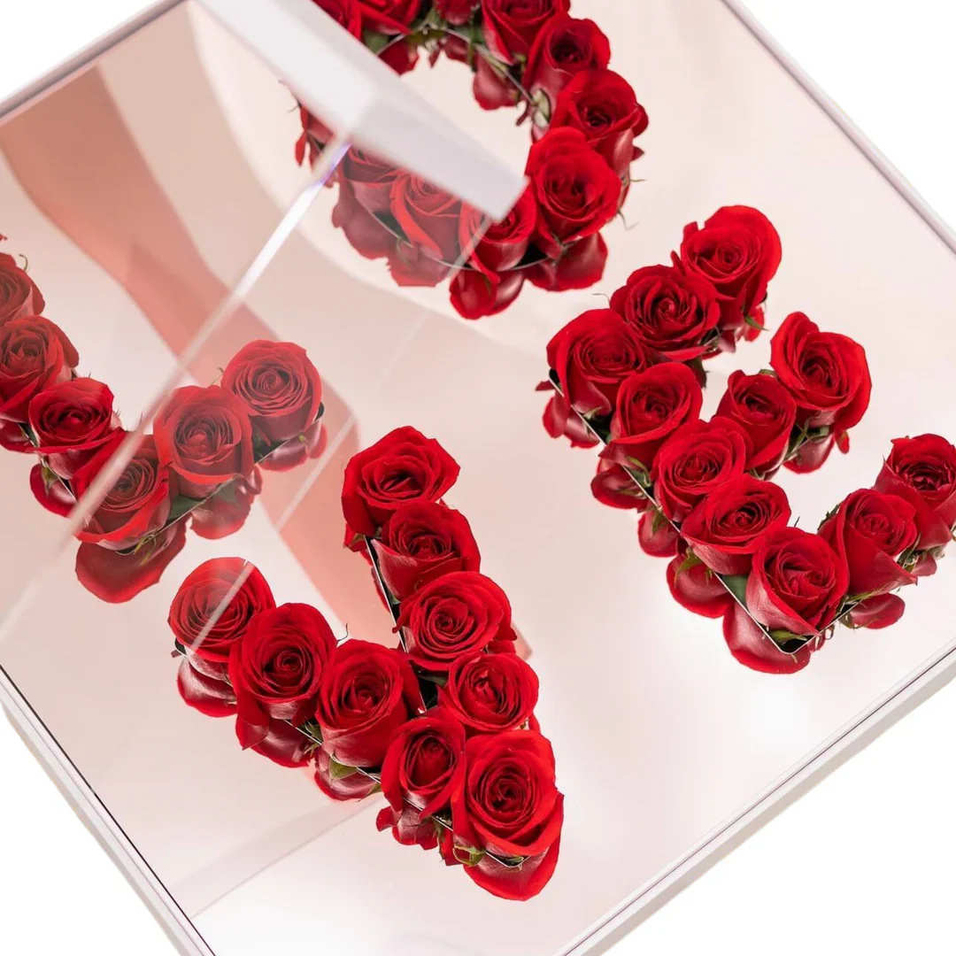 Luxury pink LOVE rose display box  - Pink acrylic display box with fresh red roses spelling love 