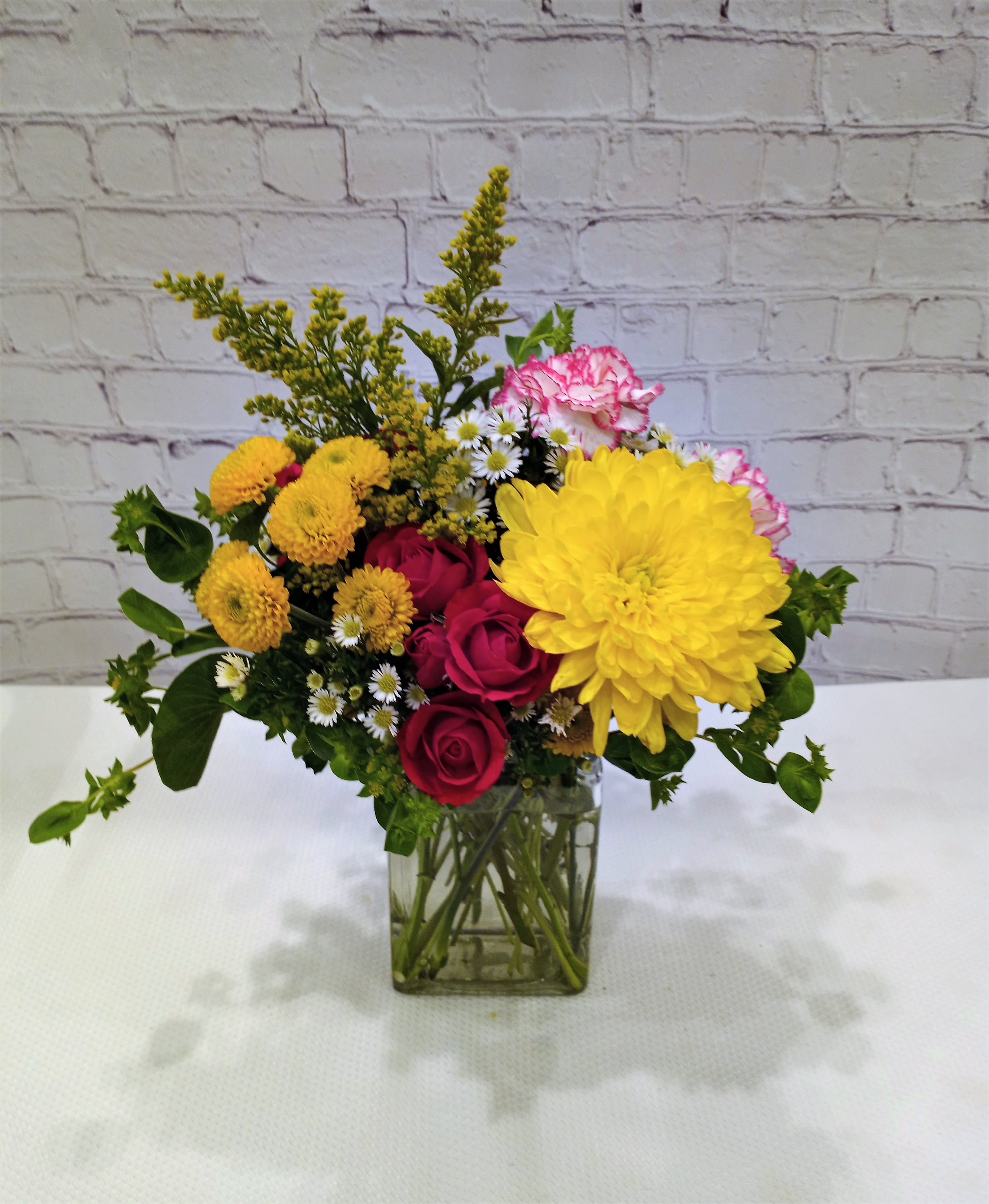 Let's Celebrate You Let's Celebrate You - A colorful array of spray roses, chrysanthemums, carnations and accent flowers. Add festive flair to your celebration.