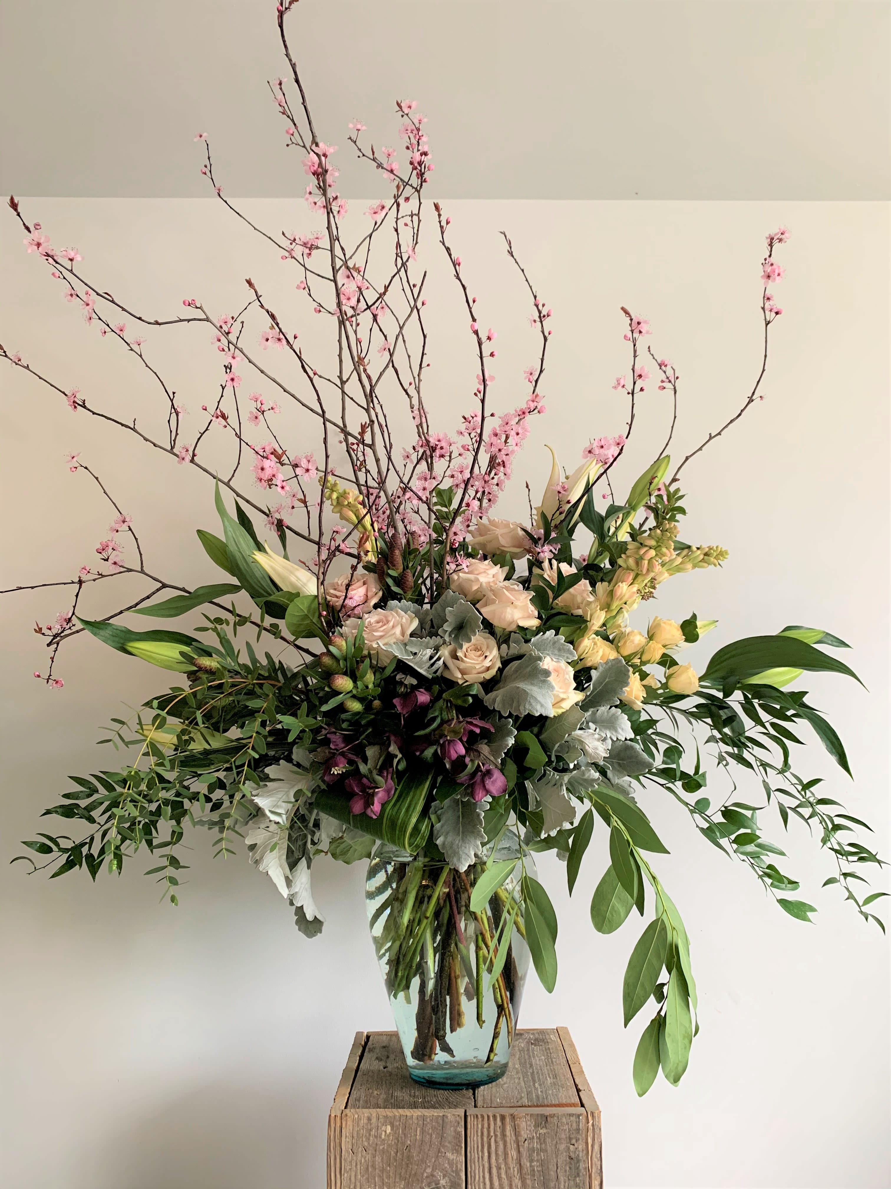 Go Big or Go Home Go Big or Go Home - Who ever said 'less is more' obviously wasn't talking about flowers! In our opinion, more is more & bigger is better. This 'designer's choice' selection measures approximate 4' tall and is lush and full of a wide variety of seasonal flowers and branches. We can customize the color palate with a few days notice. PLEASE NOTE: This option will most likely not look like the photo but will retain the look and feel of the arrangement. Color choice will also vary depending on what is available.