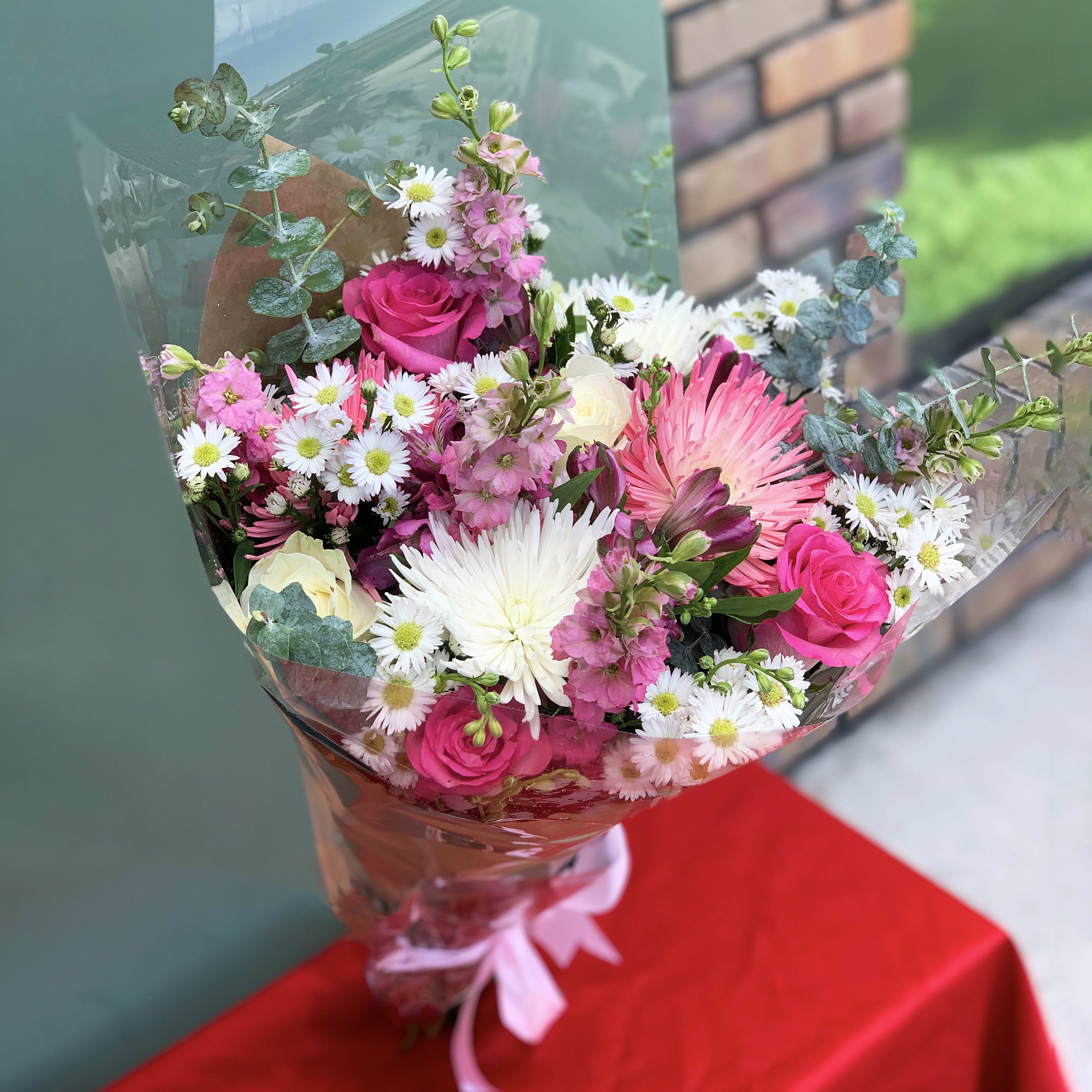 Paint Me Pink - Pink is the theme here and there is no mistaking it. This bouquet blends eucalyptus, roses, and wild flowers to create a stunning piece that is sure to impress your special one