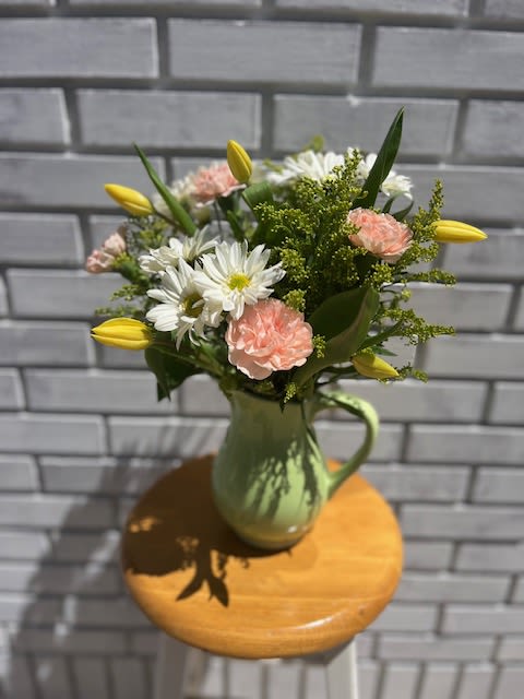 Lillian Lillian - Keepsake pitcher filled with cheerful daisies, timeless tulips and carnations. Perfectly wild and cheerful to make anyone's day brighter