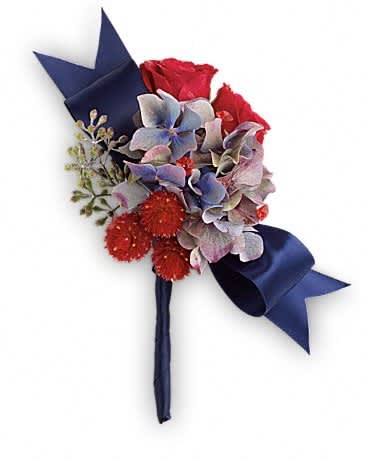 Camera Ready Boutonniere Camera Ready Boutonniere - You're ready for your close-up with this bold mix of pale blue hydrangea and rich red roses. Light blue hydrangea, red spray roses and red gomphrena.Approximately 4" W x 5 1/2" H