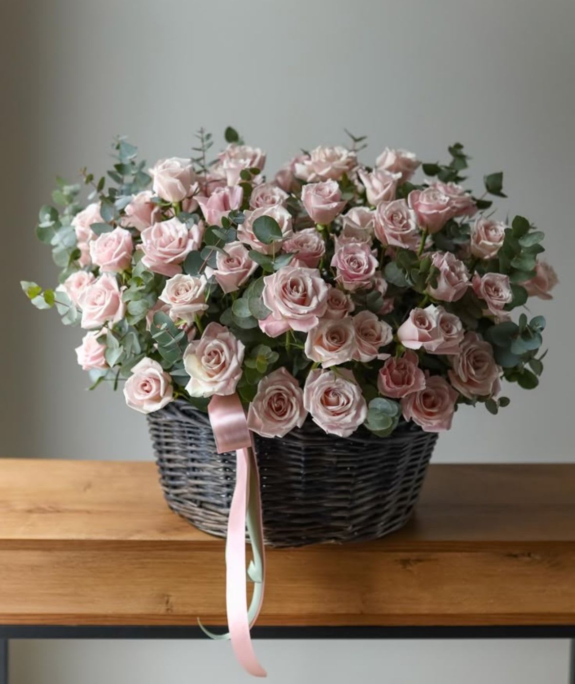 basket of pink roses with eucalyptus - basket of pink roses with eucalyptus