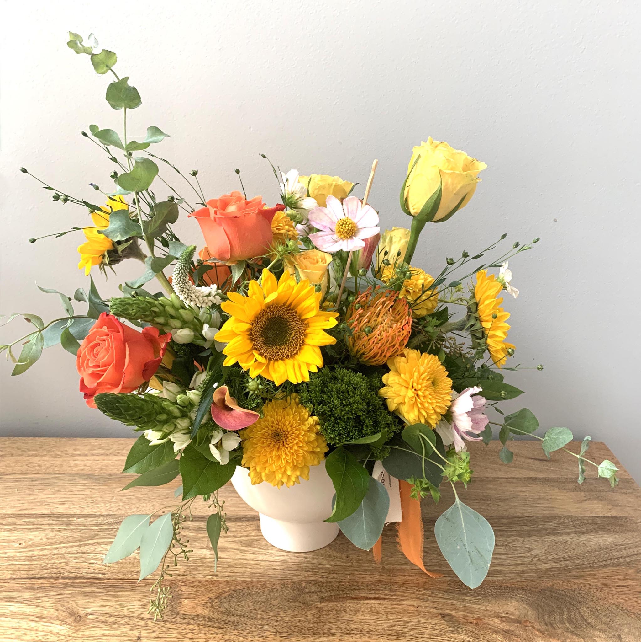 Citrus - Part of our No. 2 Soleil Collection, Citrus brings a burst of vibrant color and sunny energy, featuring the season’s brightest, happiest blooms.   Standard    |    *5” vase with a lush mix of seasonal blooms. Measures approximately 10&quot; tall x 10&quot; wide.  Deluxe    |    *6&quot; vase with a lush mix of seasonal blooms. Measures approximately 12&quot; tall x 12&quot; wide.  Premium    |    *8”+ vase or other similar sized vase with a lush mix of seasonal blooms. Measures approximately 15&quot;+ tall and wide.   *Vessels are designer choice to complement flower selection unless specified.