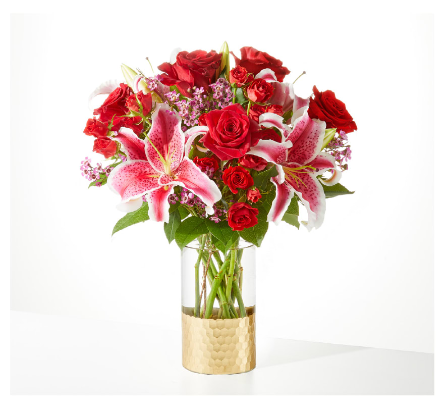 Match Made iin Heaven Bouquet by FTD Match Made iin Heaven Bouquet by FTD - Red Roses, Red Spray, Straighter. Pink Wax and greenery in Gold dipped vase SUBSITUTION POLICY In many instances, our photo may represent an overall theme or look and include a one-of-a-kind vase which cannot be exactly replicated. Although the actual bouquet may not precisely match the photo, its temperament will. Occasionally, substitutions of flowers and/or containers happen due to weather, seasonality and market conditions which may affect availability. If this is the case with the gift you’ve selected, we will ensure that the style, theme and color scheme of your arrangement is preserved and will only substitute items of equal value or higher value. If any design elements are of major importance to your order, please include them in the florist instructions at checkout or contact us to ensure availability.