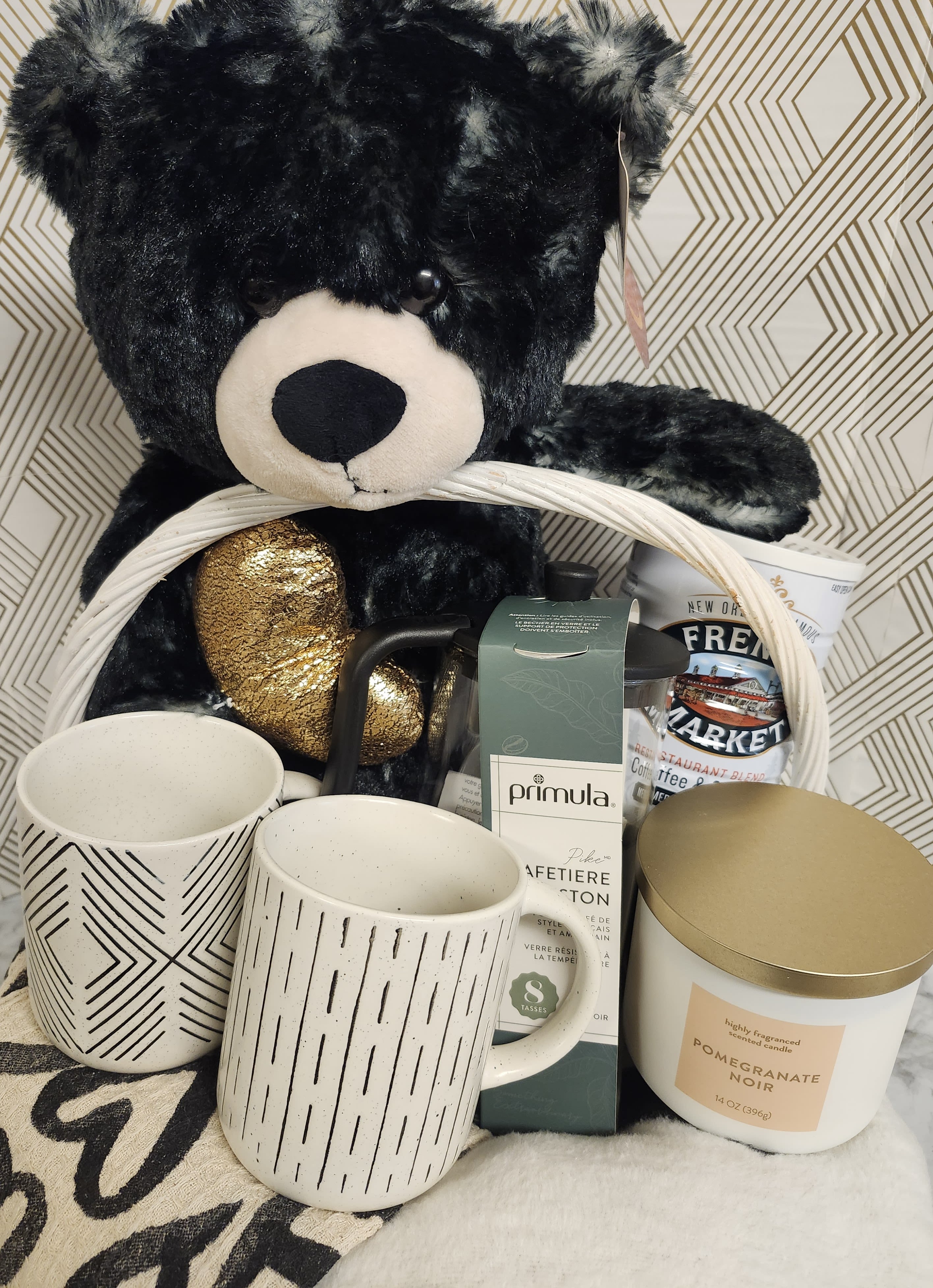Cozy Coffee Basket – $170 - These baskets are one of a kind. Please call to order 504-341-4305.  Enjoy this cozy black and white basket, perfect for the coffee lover in your life.   Basket Features:  Luxe Blanket  Coffee Press Coffee Mug Set French Market Coffee Tea Towel Set Candle  Soft Teddy Bear   Delivered in a sturdy picnic style basket.  