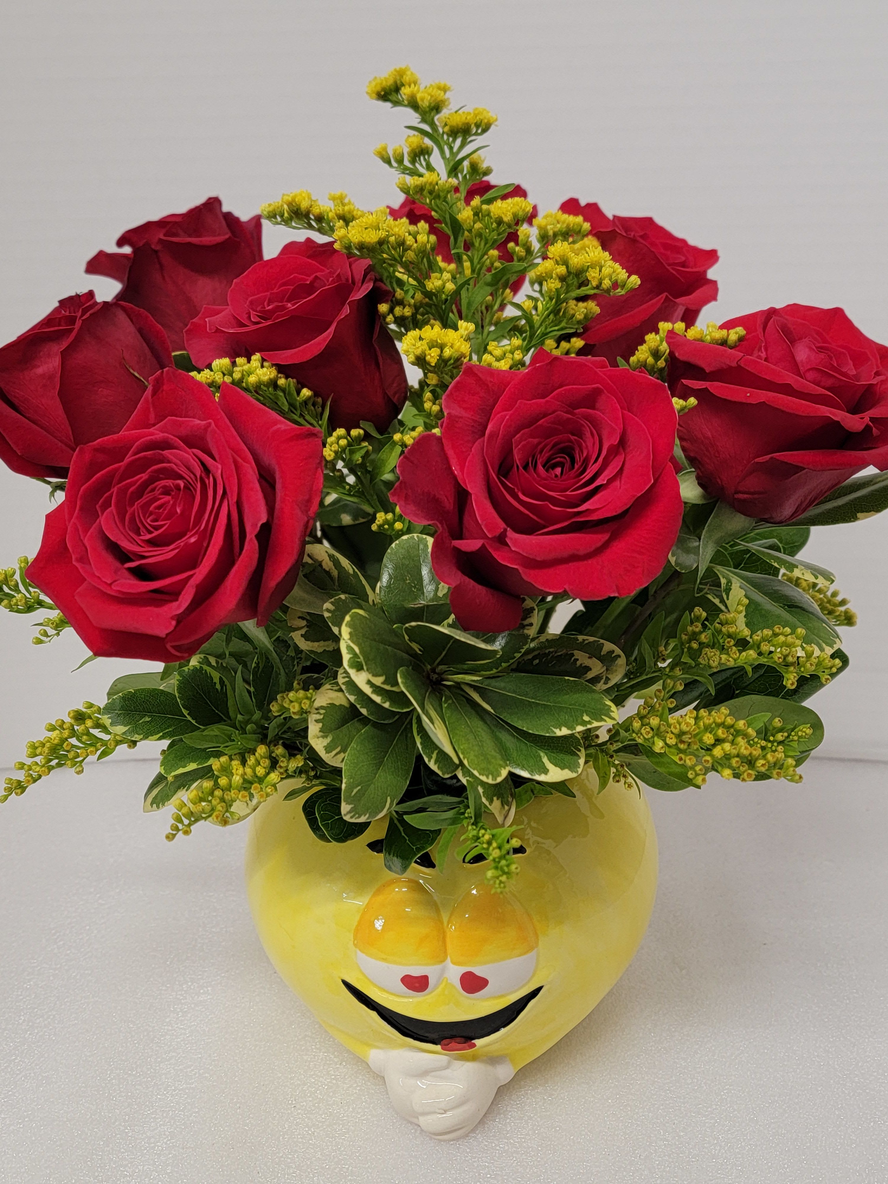 Love You Alot! Love You Alot! - A Gift two in one. Eight red roses in a happy face container.