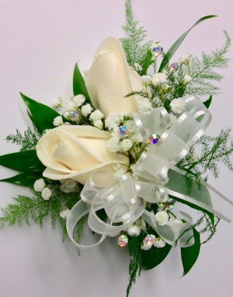 White Roses - *ALL ORDERS MUST BE PLACED 30 DAYS IN ADVANCE FOR WEDDINGS…1 WEEK FOR PROM *Love this design, but, looking for different colors.  There is typically no cost difference involved in adjusting colors.  Simply e-mail us letting us know what colors you have in mind and we can confirm availability before your order is placed. * Indicate Pin On or Wrist Corsage in Florist Instructions When Checking out