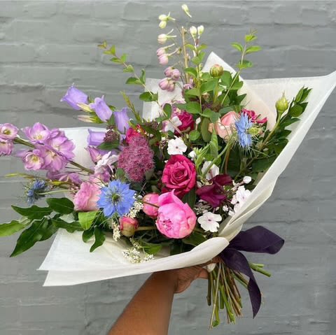 Hand Tied Mixed Floral Arrangement   - Designers choice of color scheme and a beautiful mix of colors and greens. 